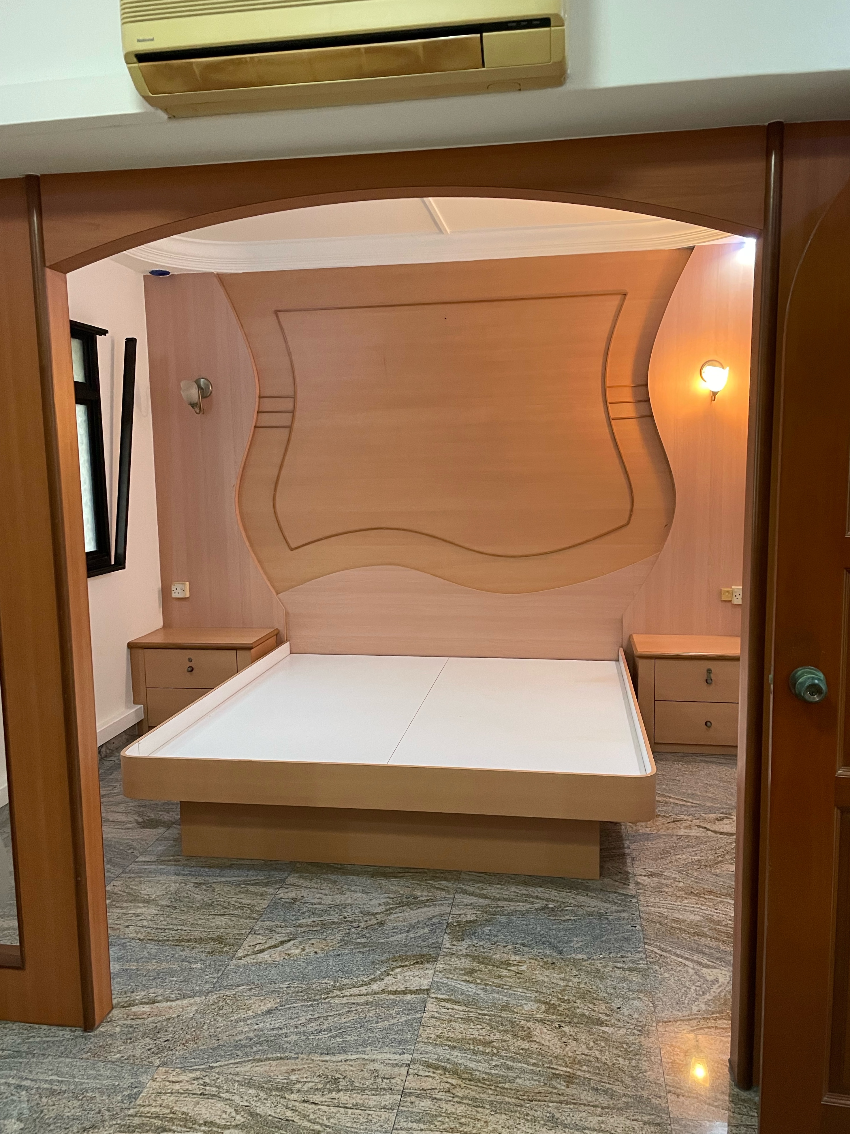 Inspiration from a Staycation: A Lounge Area in Our Bedroom - Wooden headboard, modern bedroom, minimalist design, wooden bed