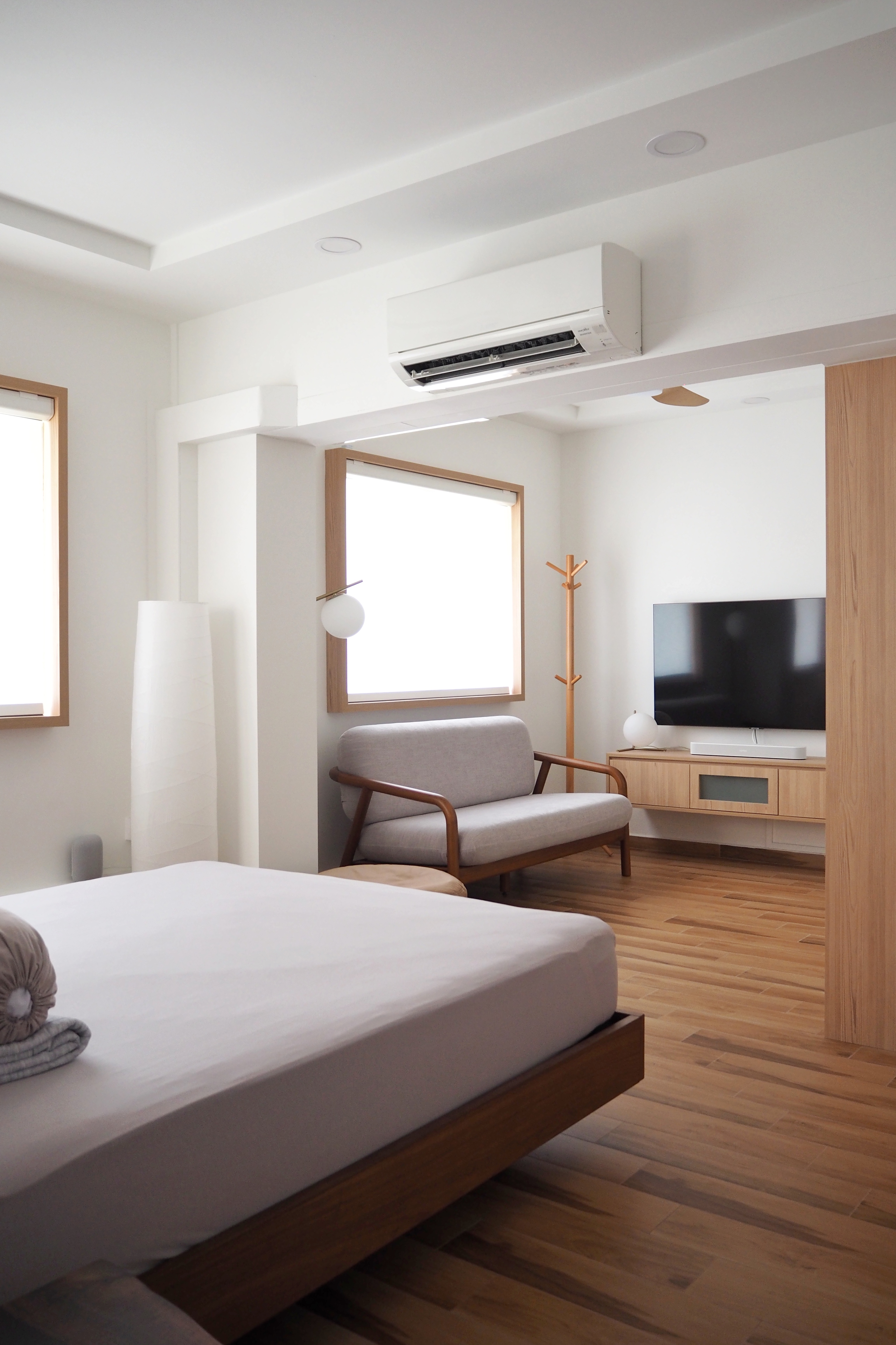 Inspiration from a Staycation: A Lounge Area in Our Bedroom - Modern minimalist bedroom, sleek furniture, wooden flooring