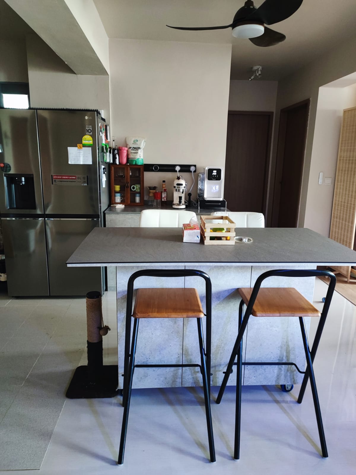 A Low-Cost & Open Concept Kitchen with Stone and Industrial Touches - Modern kitchen with stainless steel refrigerator, gray