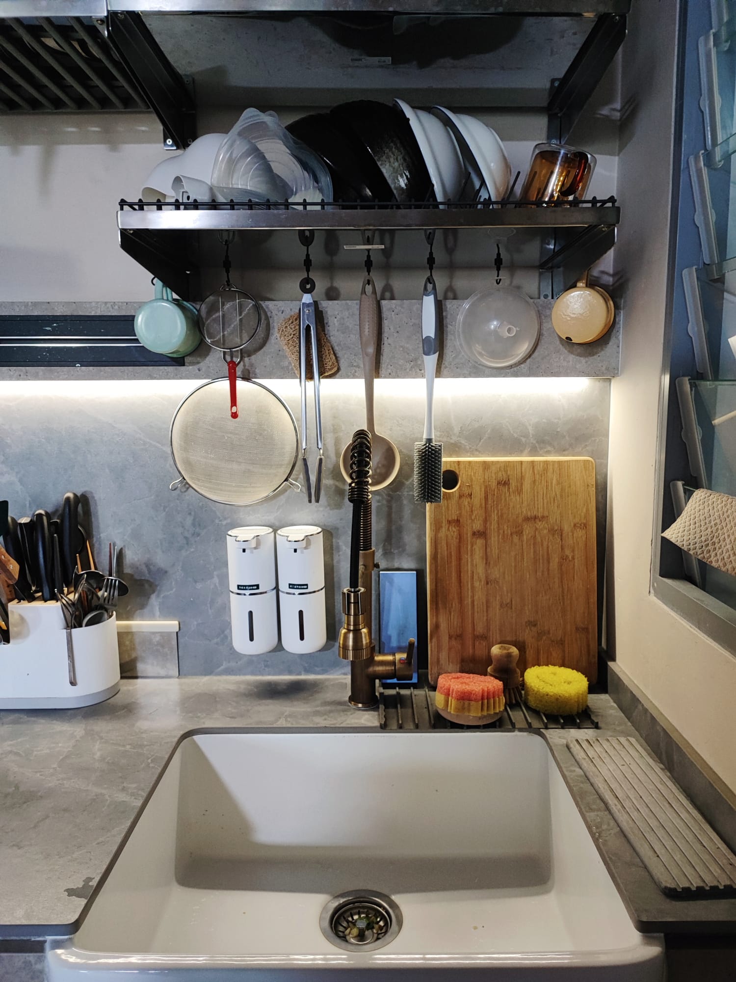 A Low-Cost & Open Concept Kitchen with Stone and Industrial Touches - silverware rack, hanging utensils, stainless steel