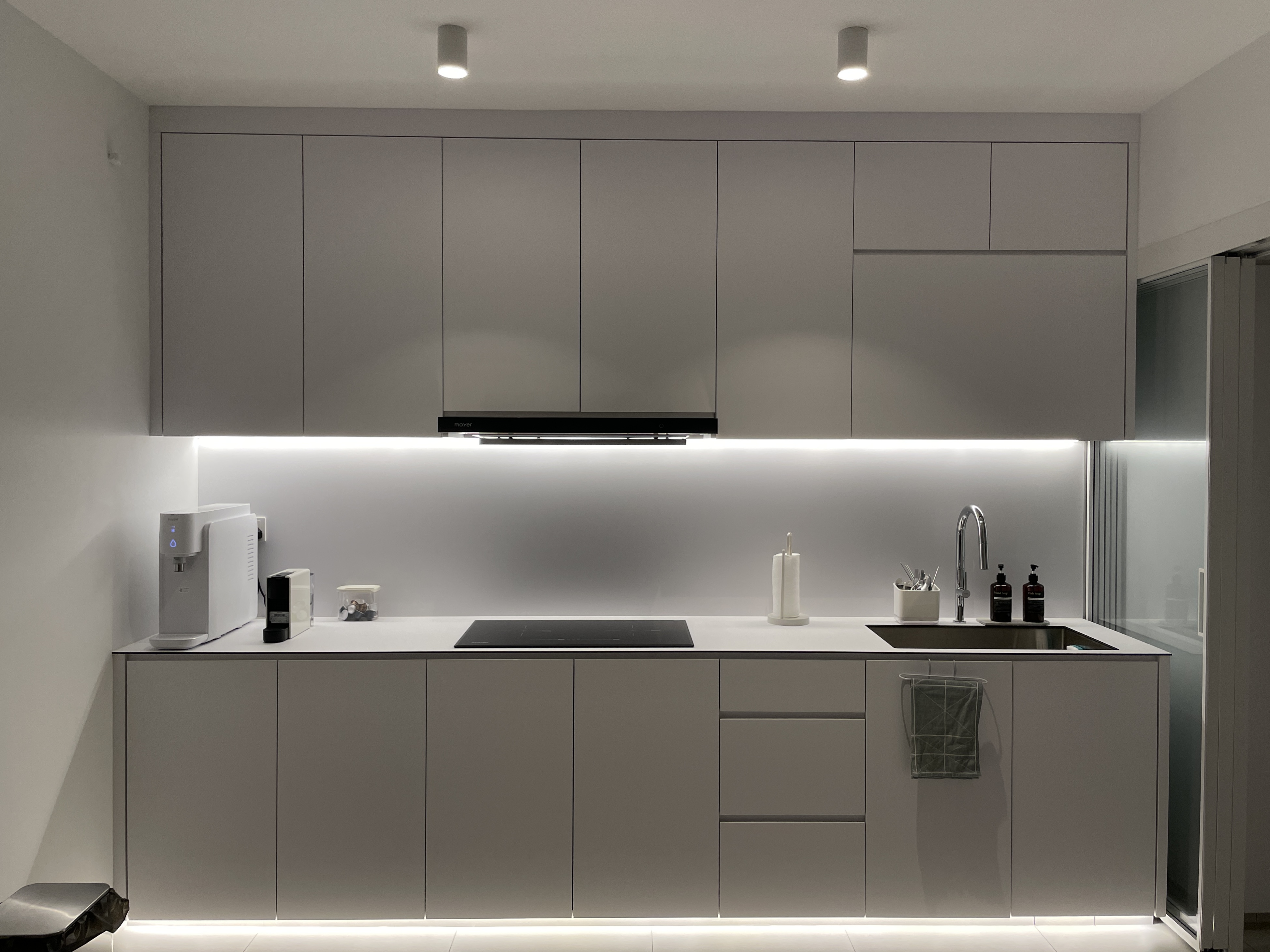 What’s Cooking? ; Minimalist Full-White Kitchen with Ample Storage - Modern kitchen with sleek grey cabinets, minimalist