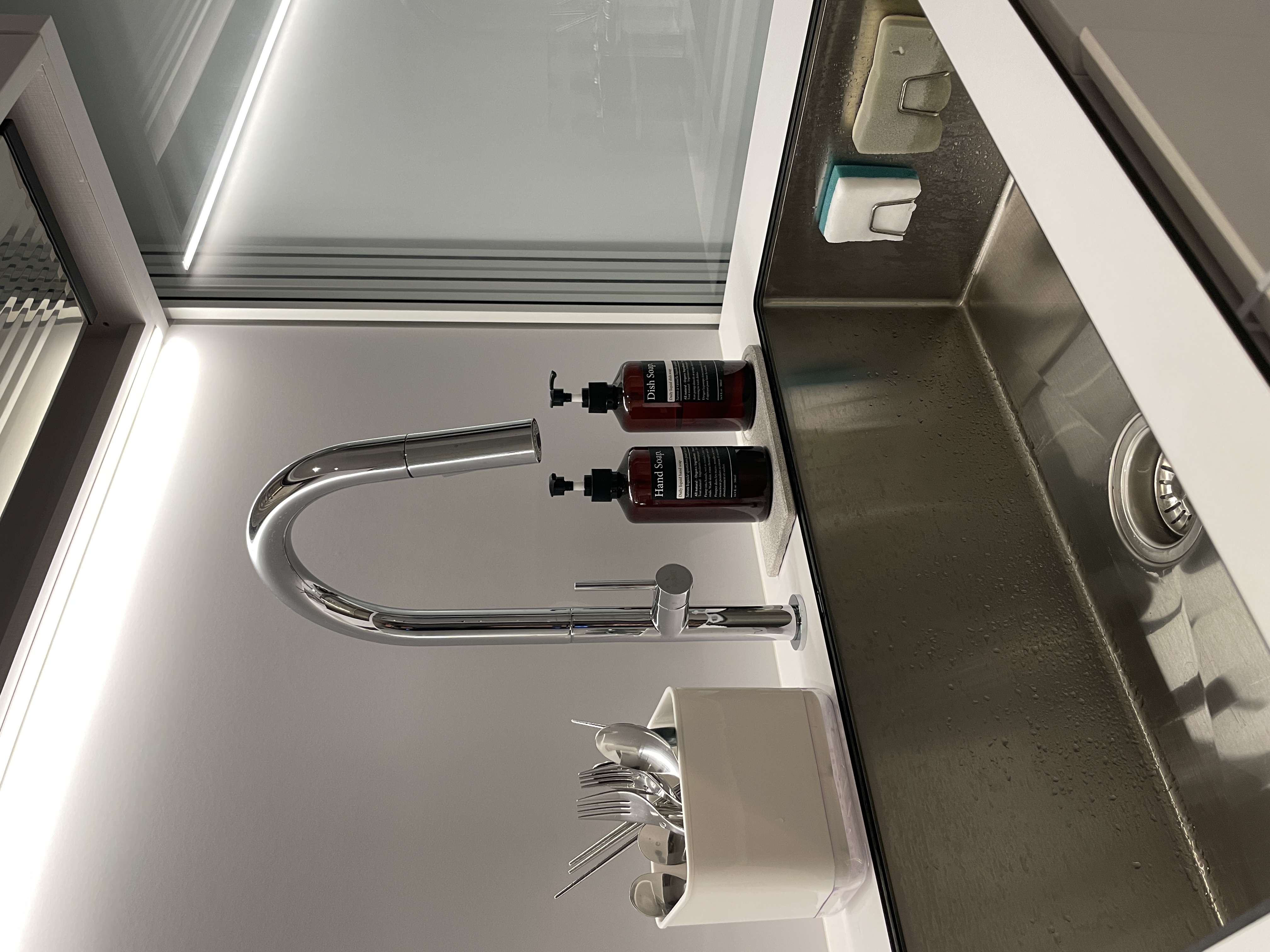 What’s Cooking? ; Minimalist Full-White Kitchen with Ample Storage - Modern kitchen sink, sleek faucet, stainless steel sink