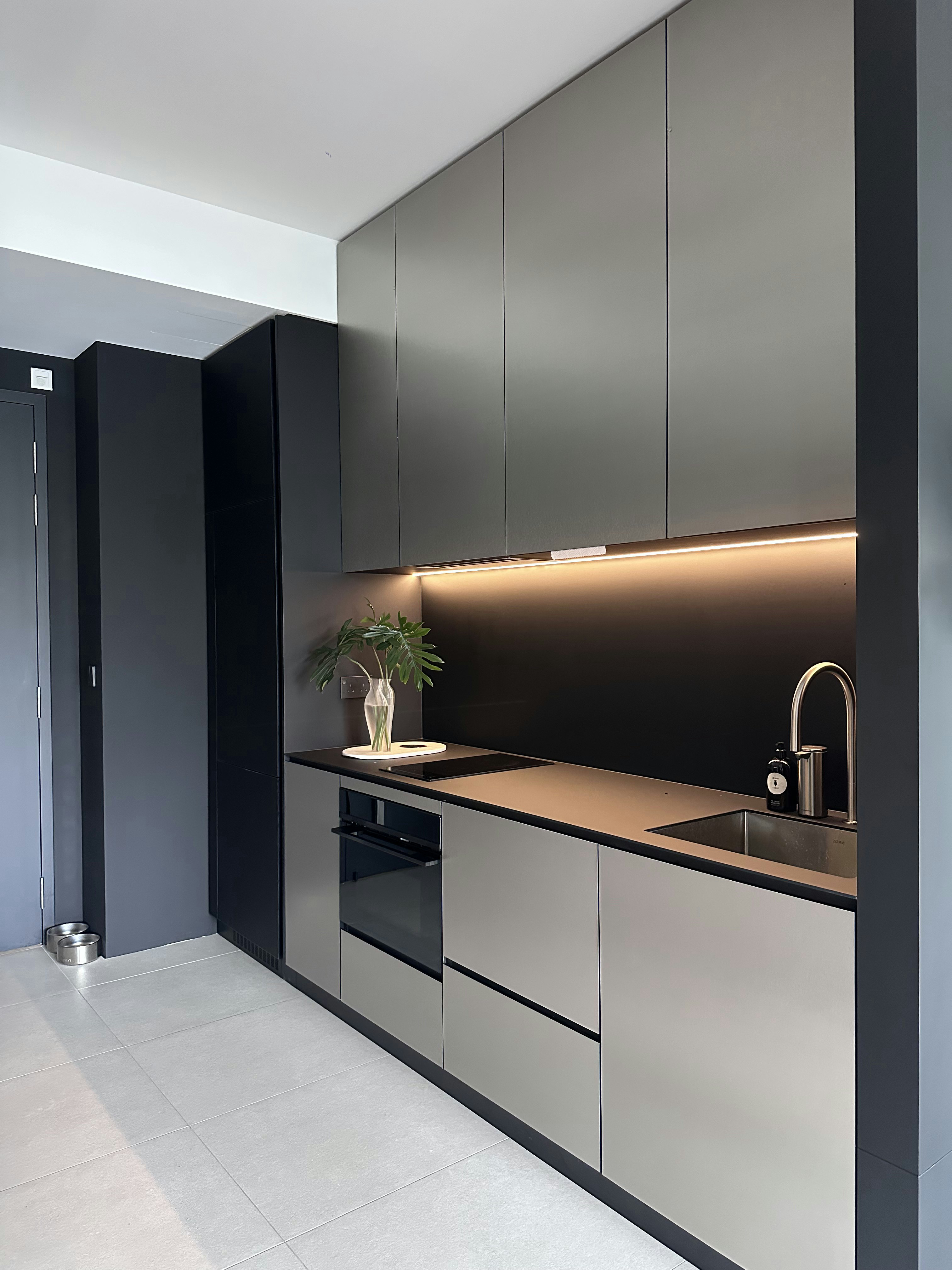 A Tour of Our Modern Kitchen with Fully Integrated Appliances - Modern kitchen with sleek cabinets, minimalist design, dark