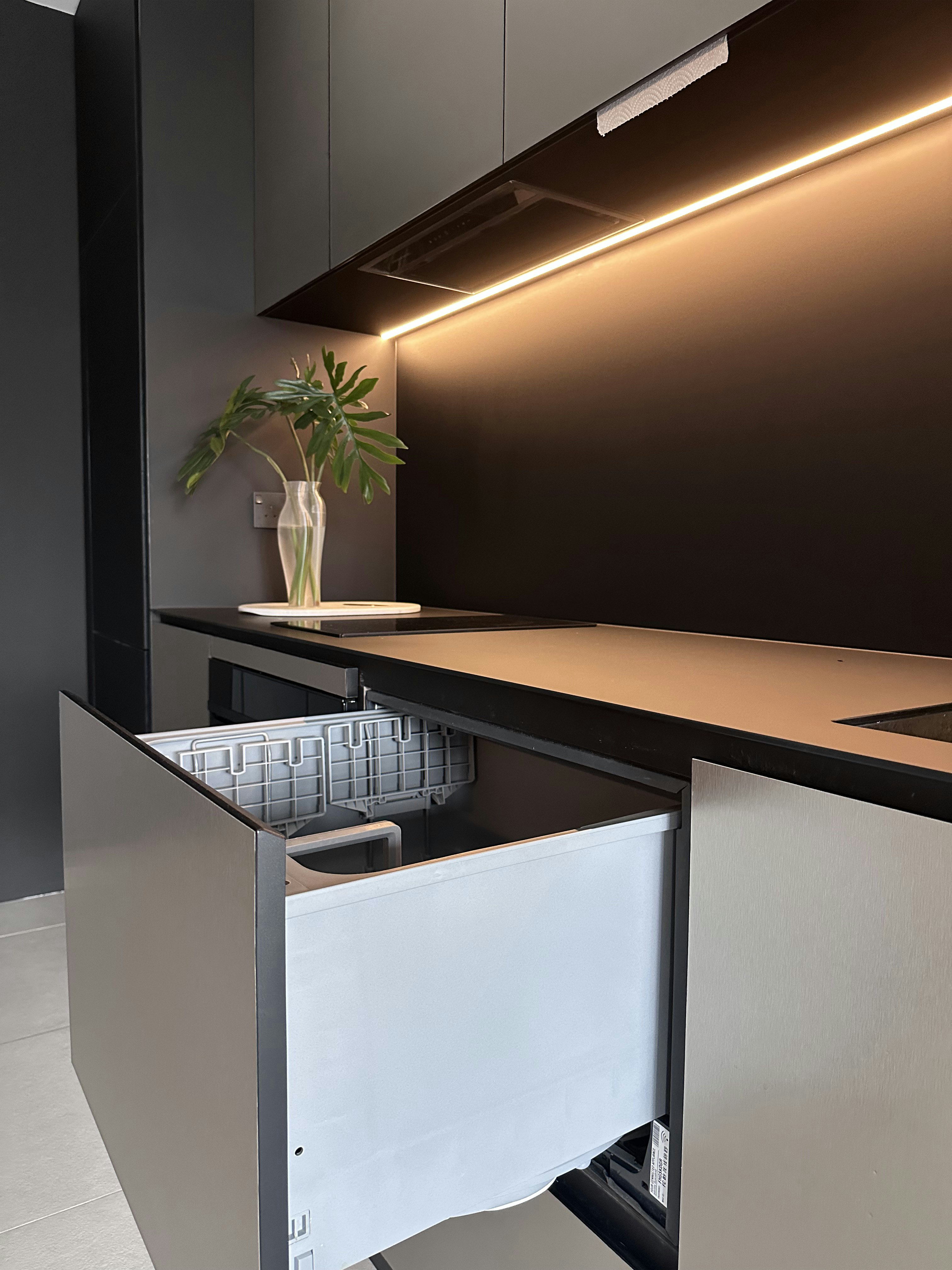 A Tour of Our Modern Kitchen with Fully Integrated Appliances - Modern kitchen countertop, sleek cabinets, under-counter