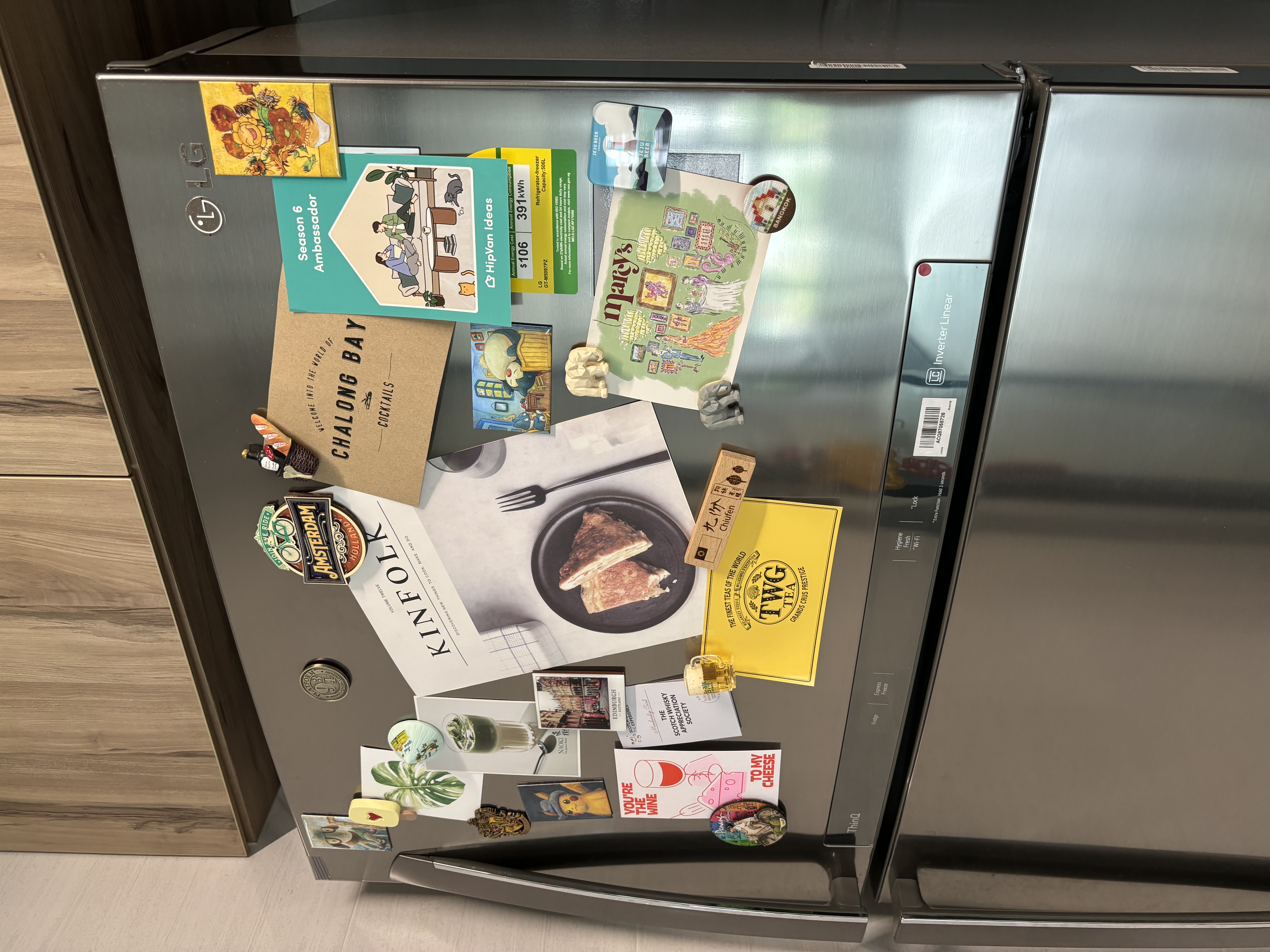 Our Food Playground with Subway Tiles and Pop of Colour - "Magnetic refrigerator adorned with vintage magnets and postcards"