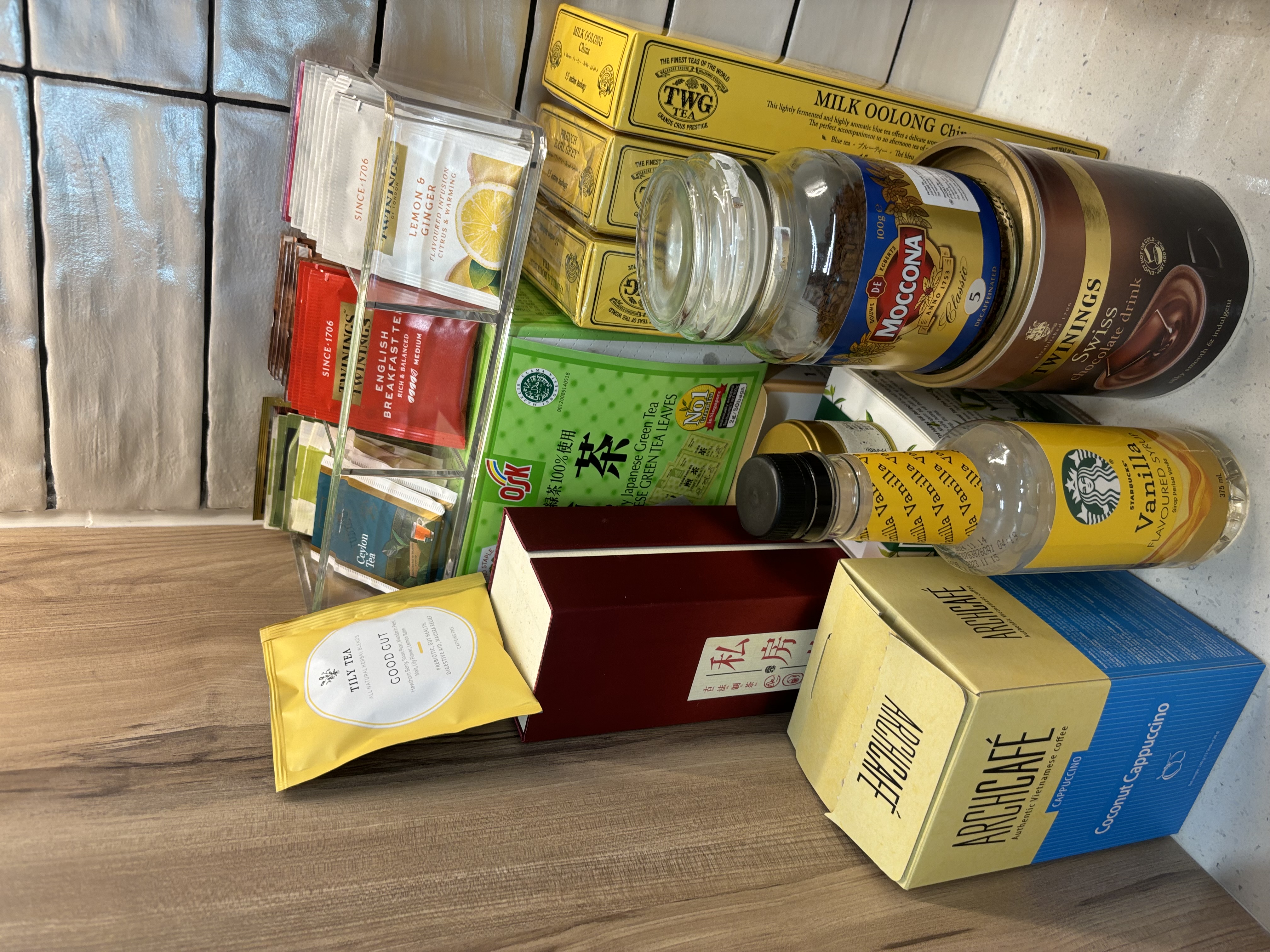 Our Food Playground with Subway Tiles and Pop of Colour - Tea bags, milk oolong tea, cocoa, coffee, vanilla extract, herbal