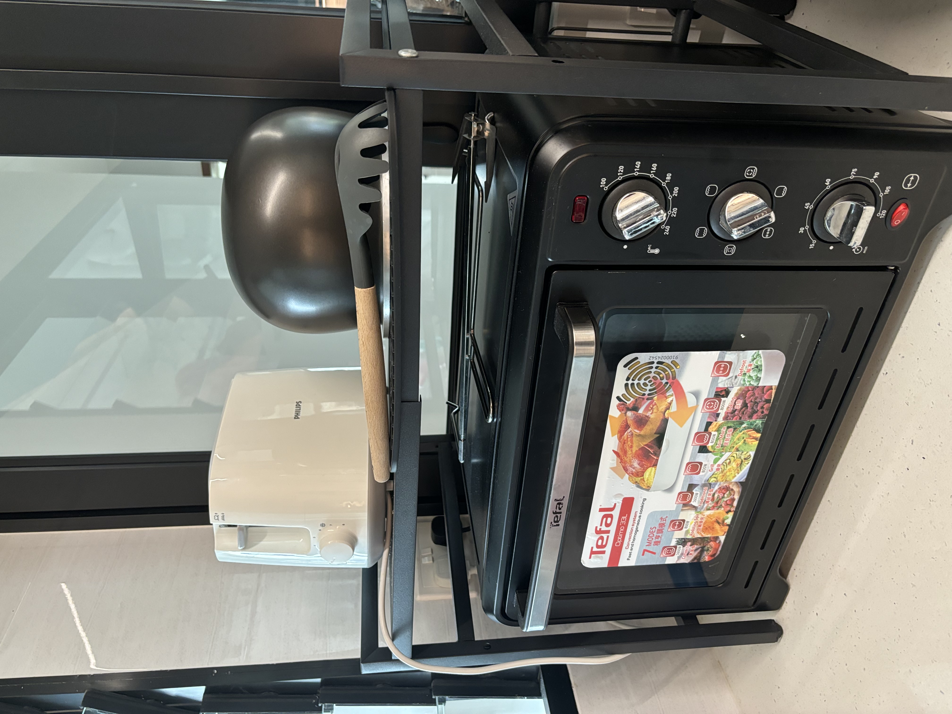 Our Food Playground with Subway Tiles and Pop of Colour - Modern kitchen appliance, Tefal oven, digital control panel, black