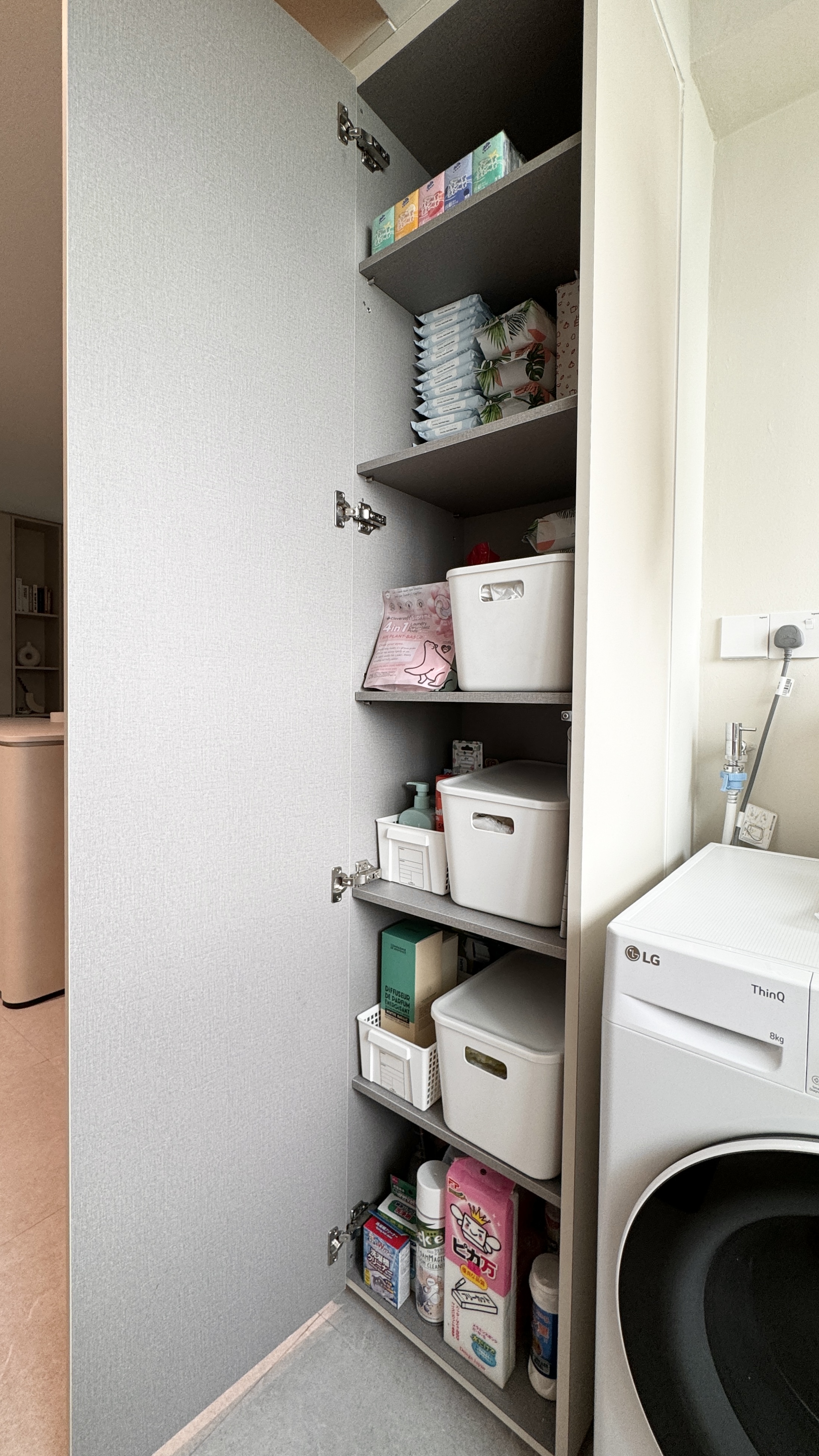 🏠✨Effortless Organization: Tips to Maximize Space and Create Flow - Grey storage cabinet, neatly organized, shelves, laundry