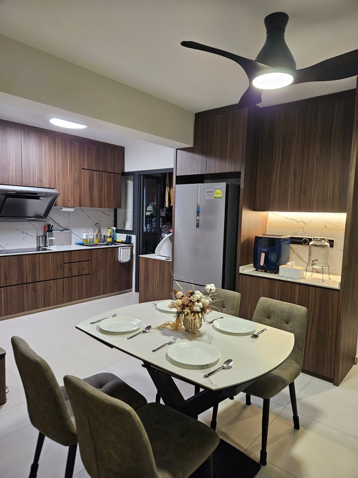Kitchen: Happiness is homemade food! - modern kitchen with wooden cabinets, sleek stainless steel refrigerator, dining table