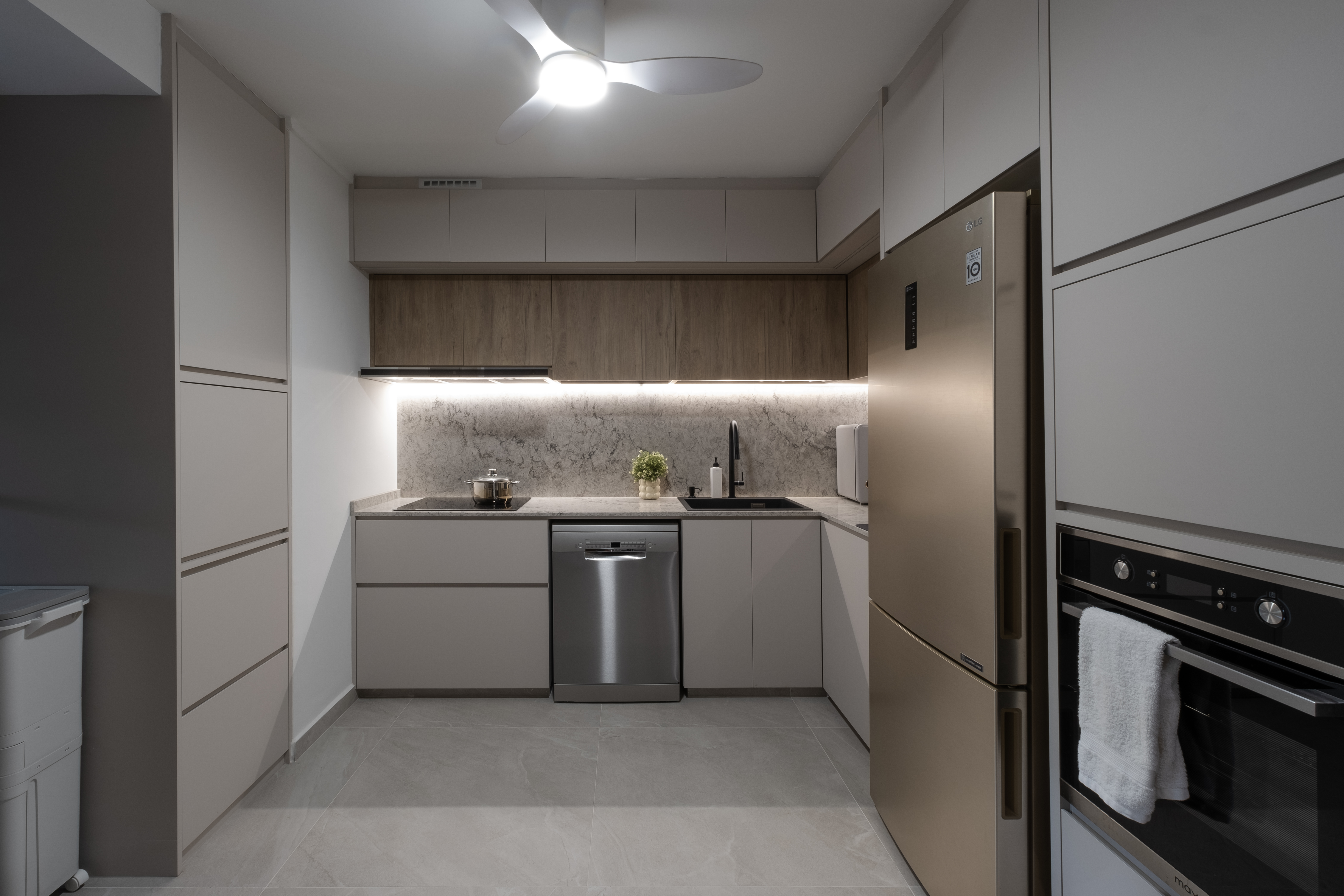 Sleek Open Concept Kitchen: Warm Tones with Minimalist Elegance - Modern kitchen with sleek stainless steel appliances