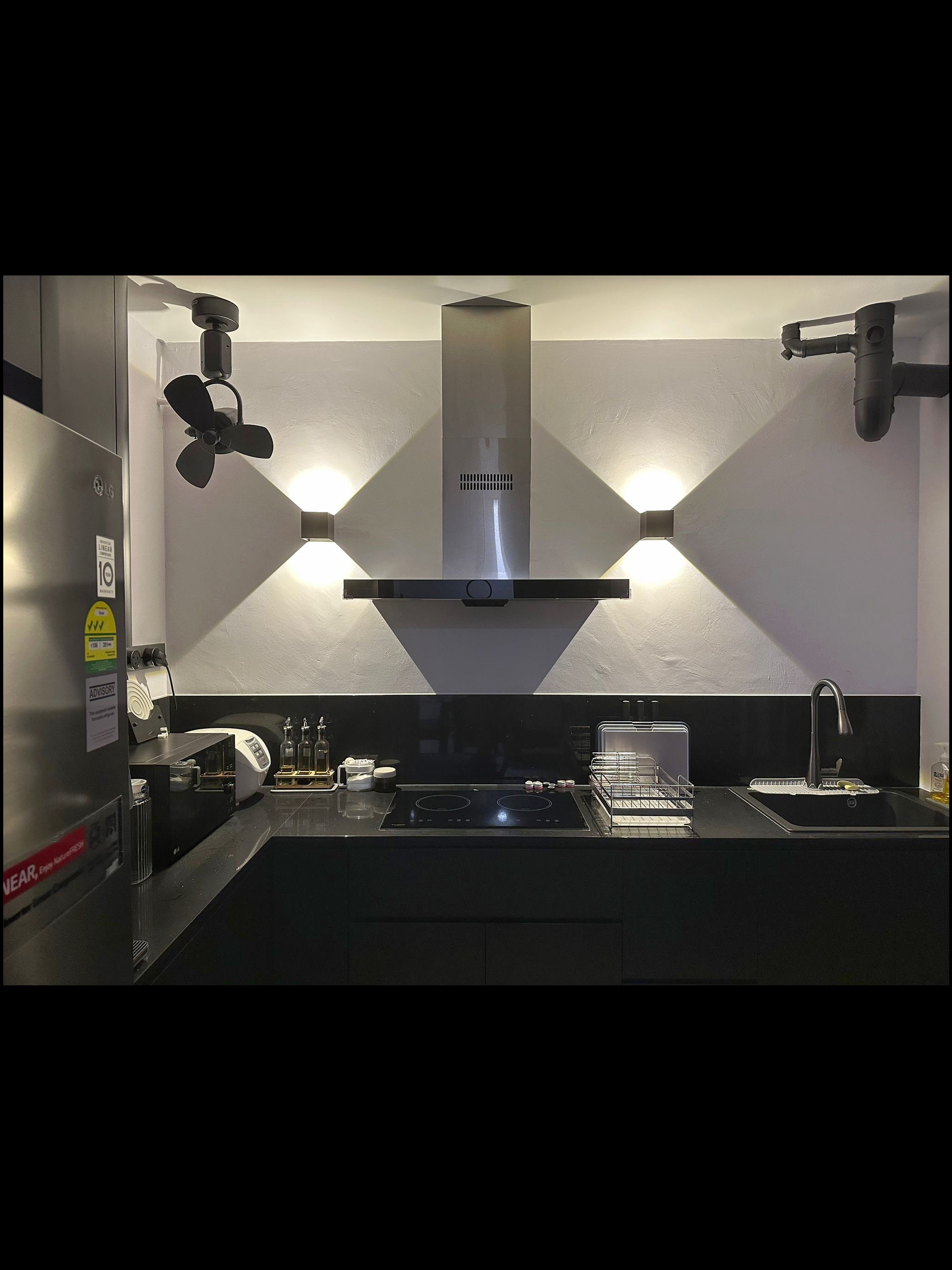 Minimal and Functional Kitchen! - Modern kitchen with sleek stainless steel appliances, black countertops, and minimalist