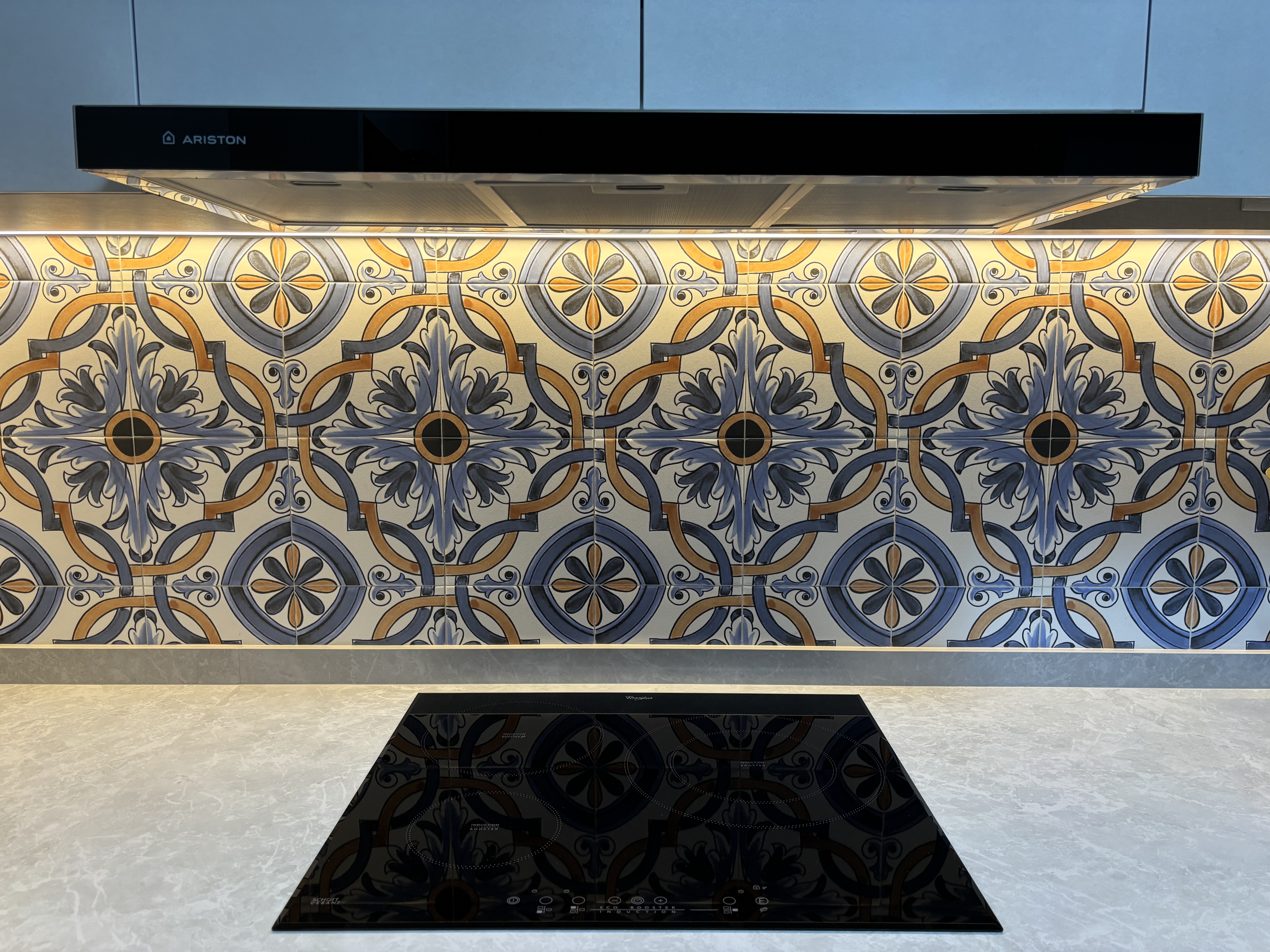 Small tiles for backsplash?! Inside a modern Spanish style kitchen - Elegant kitchen design featuring intricate tile