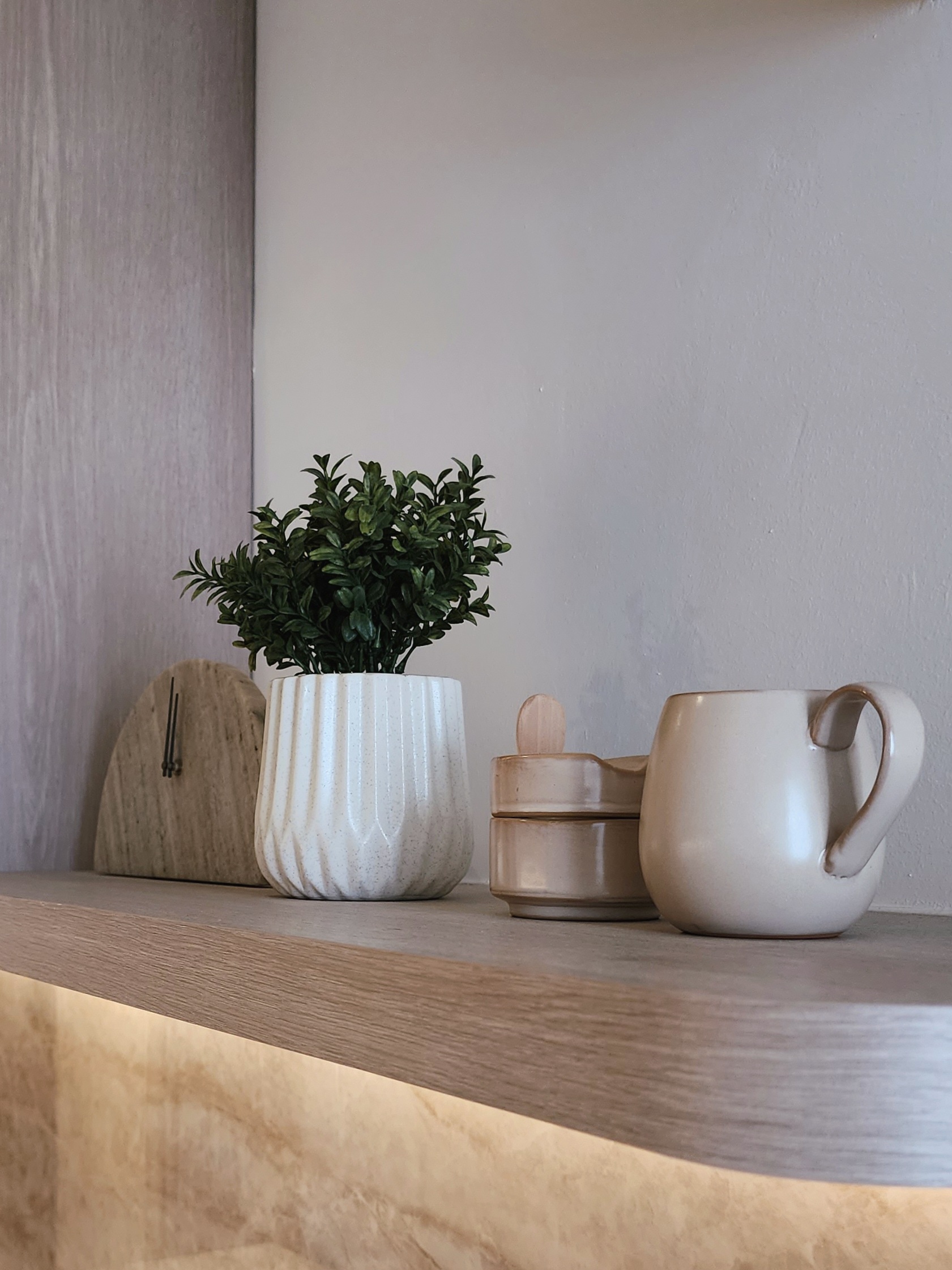 Our Kitchen: How We've Grown To Love Our Closed-Concept Kitchen - vibrant green potted plant, minimalist decor, natural wood