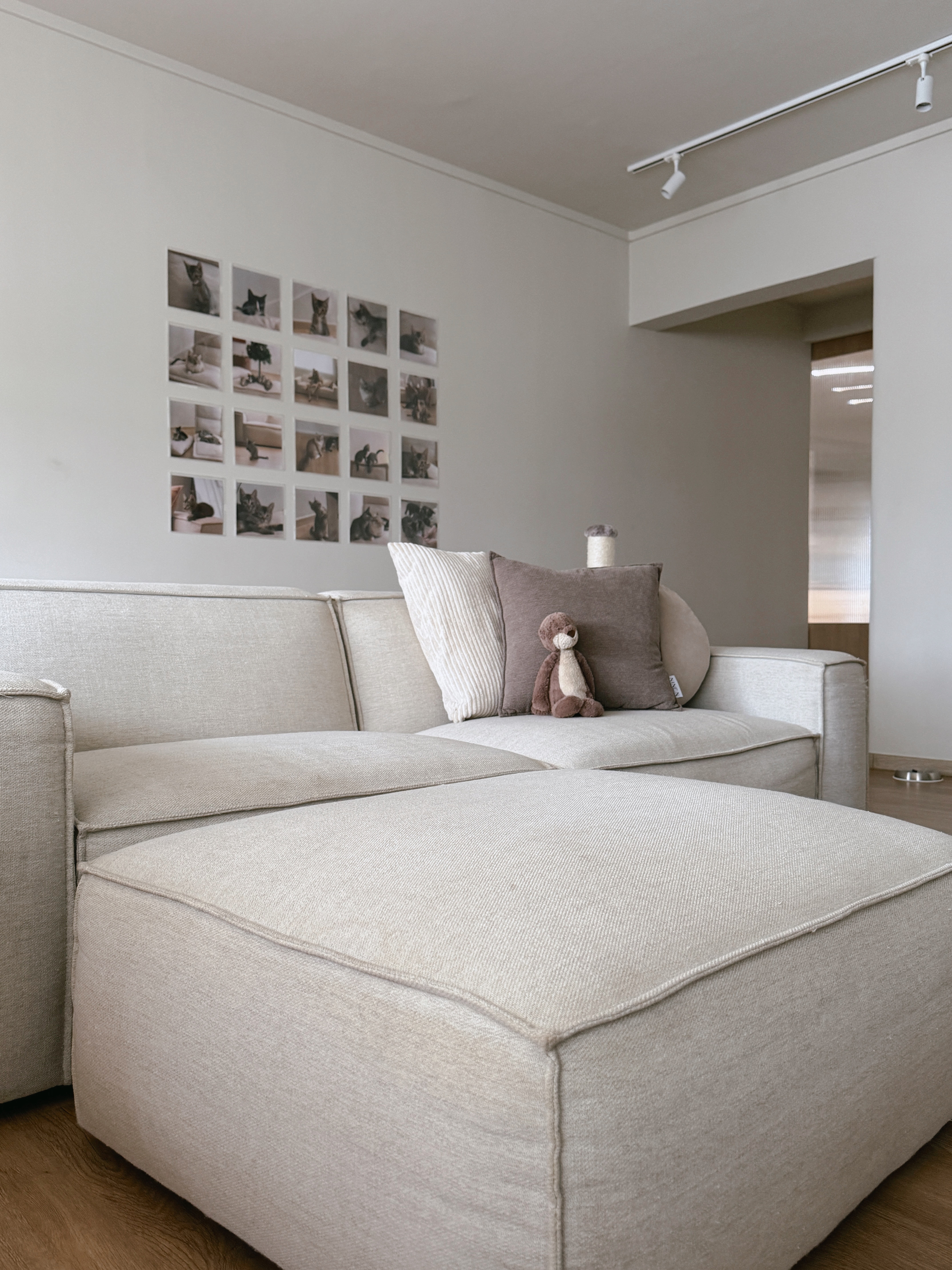 Turn Your House into a Home with These Personal Favorites - Light beige sectional sofa, minimalist decor, soft cushions