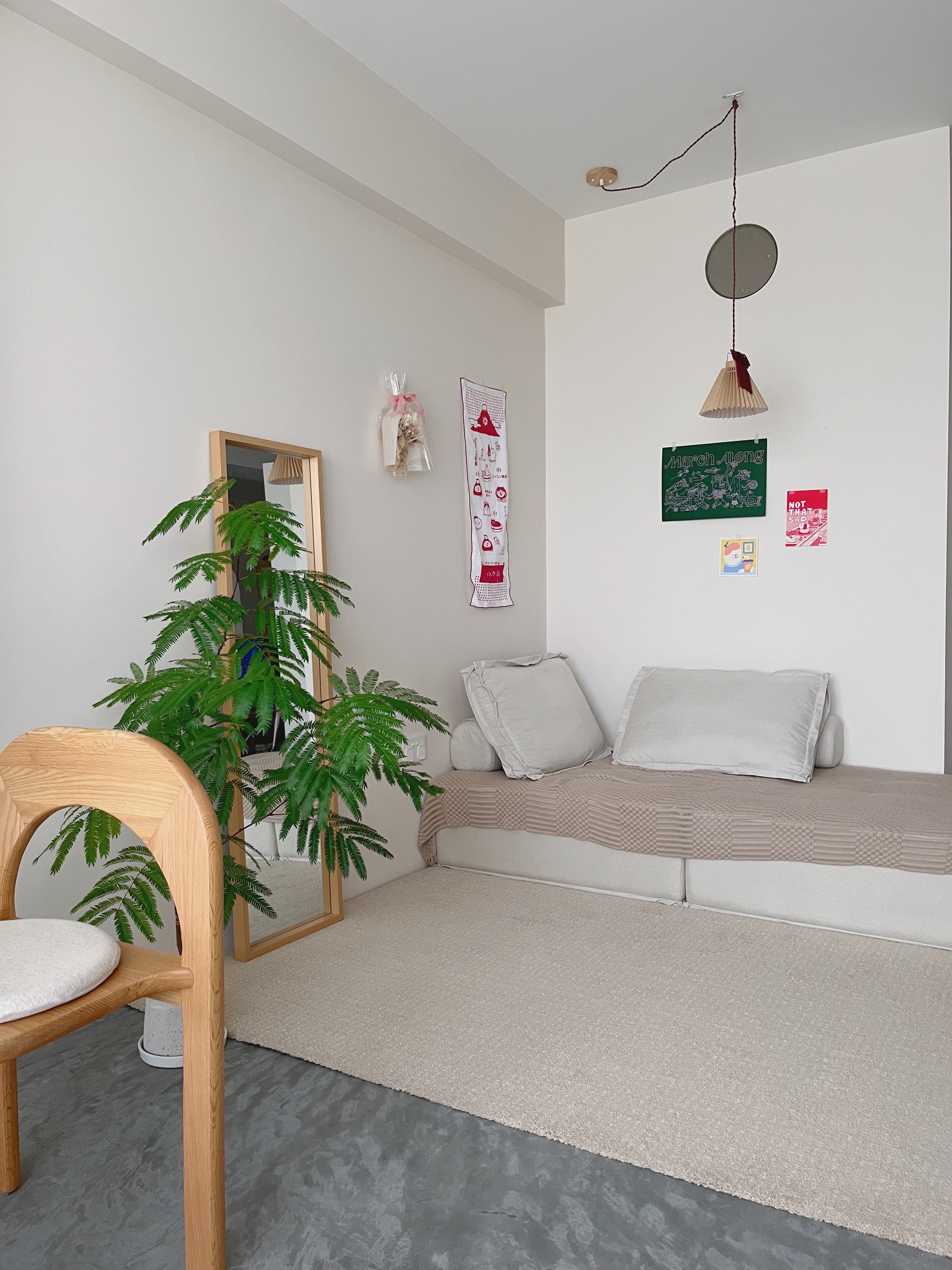 Using Art Prints to Change the Mood of Our Home - Minimalist living space, modern decor, neutral color palette, wooden