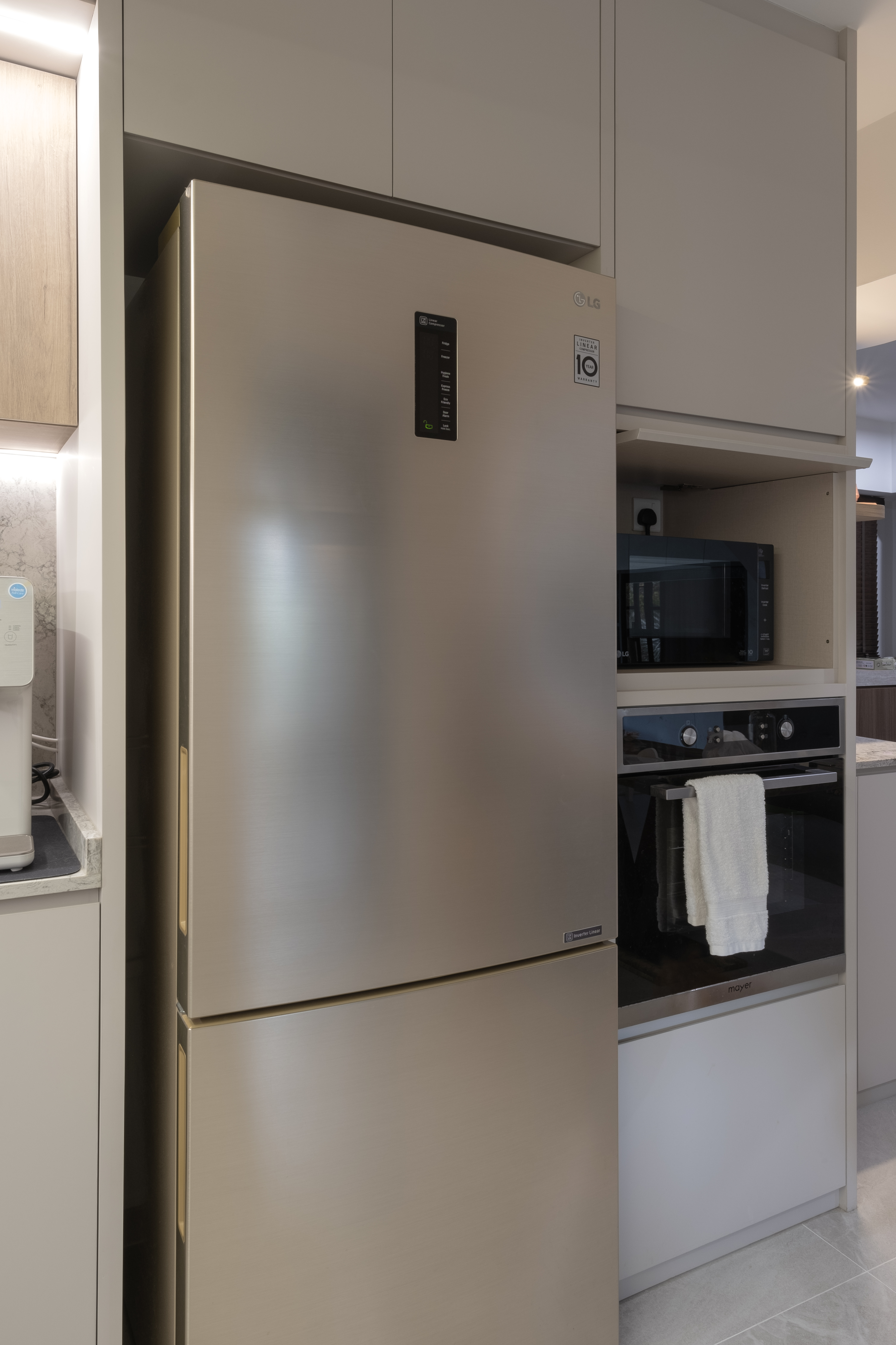 Sleek Open Concept Kitchen: Warm Tones with Minimalist Elegance - Modern kitchen with stainless steel refrigerator, built-in