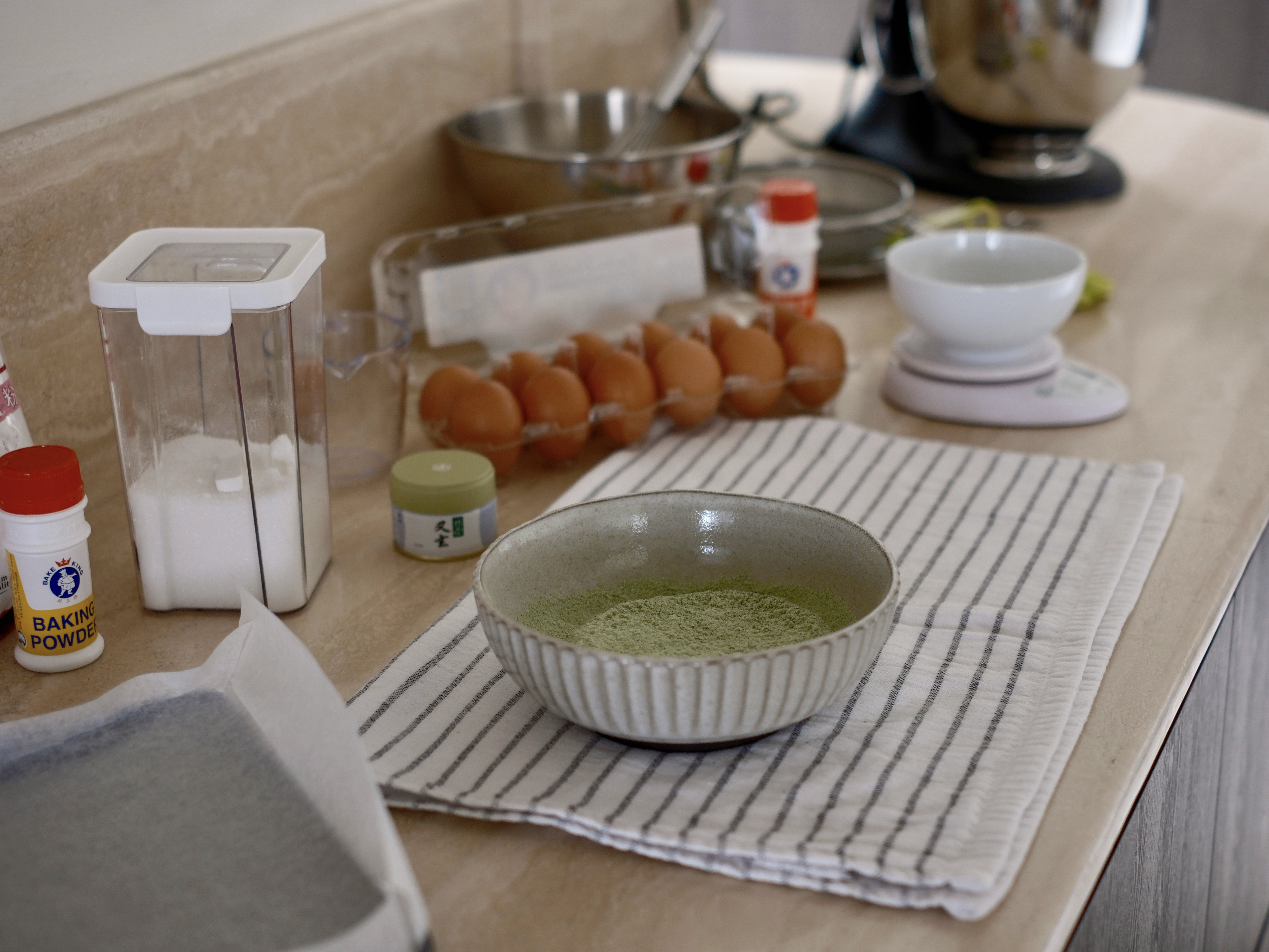 Our Travertine & Dark Oak Kitchen: Open-Concept with Ample Countertop - Baking powder, eggs, whisk, measuring cup, salt