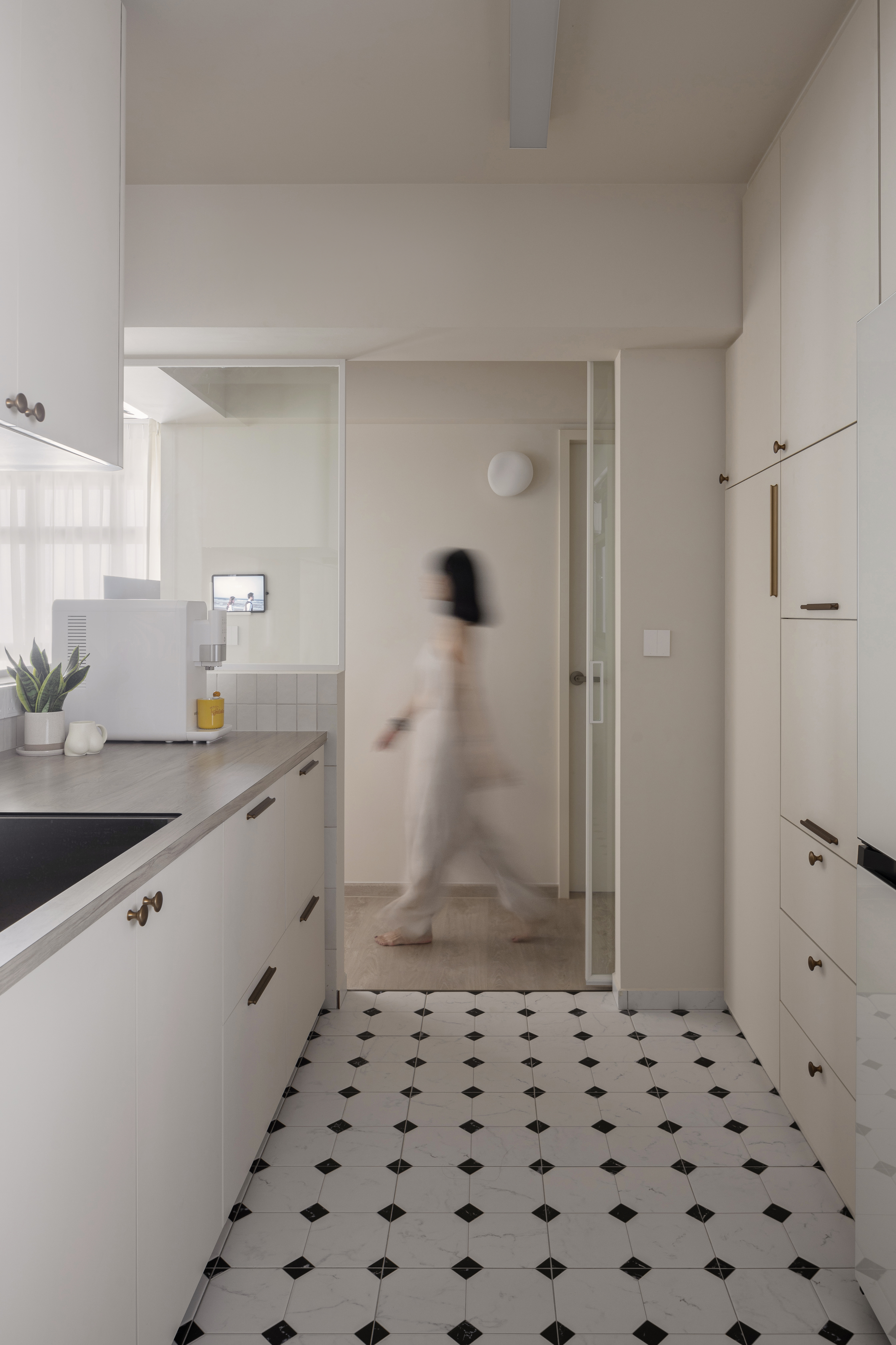 Our Kitchen: Soft Palettes and Clean Designs - Modern kitchen with minimalist design, white cabinets and drawers, black and