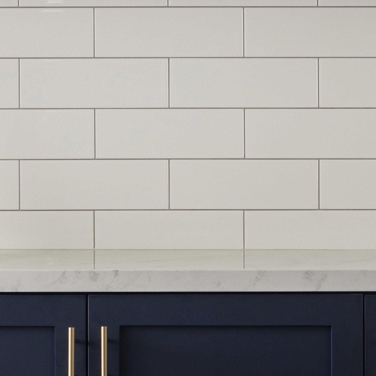 Renovation regrets: things we could have chosen for easier upkeeping! - White subway tile backsplash, dark navy cabinetry