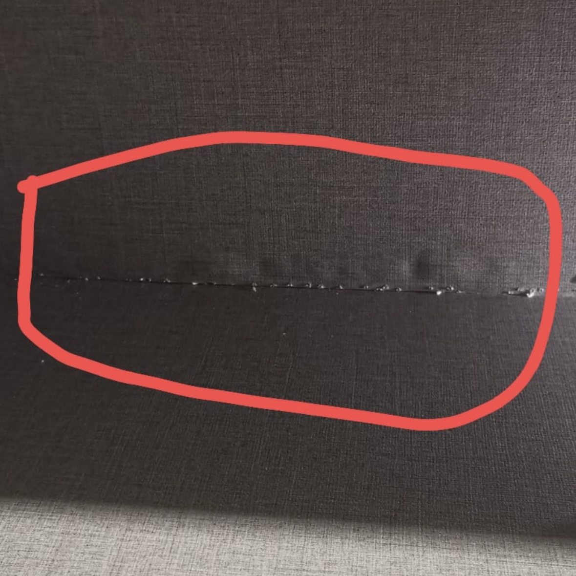 Renovation regrets: things we could have chosen for easier upkeeping! - Cracked seam on dark fabric, Visible seam damage on