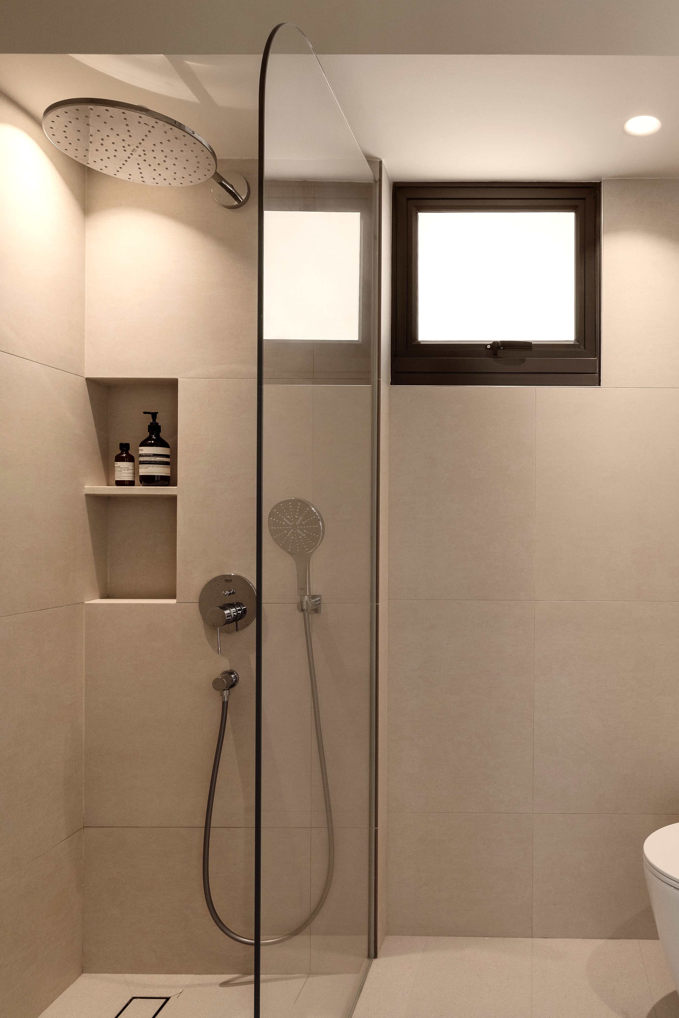 Creating A Soft Toned Master Bathroom - shower enclosure, modern bathroom, beige tiles, sleek design, minimalist decor
