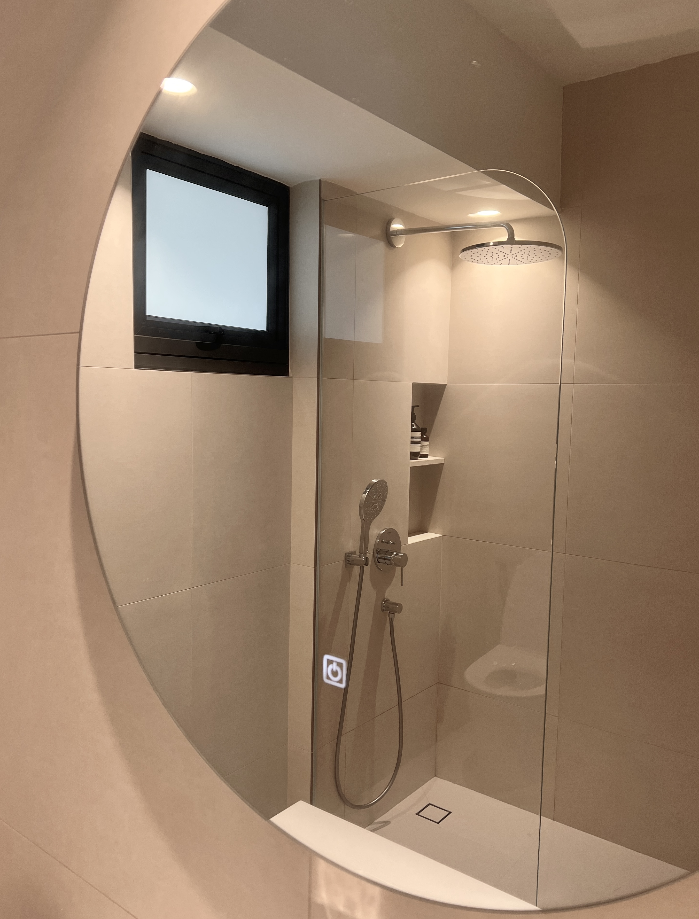 Creating A Soft Toned Master Bathroom - Modern minimalist bathroom, beige tiles, sleek shower enclosure, glass shower door