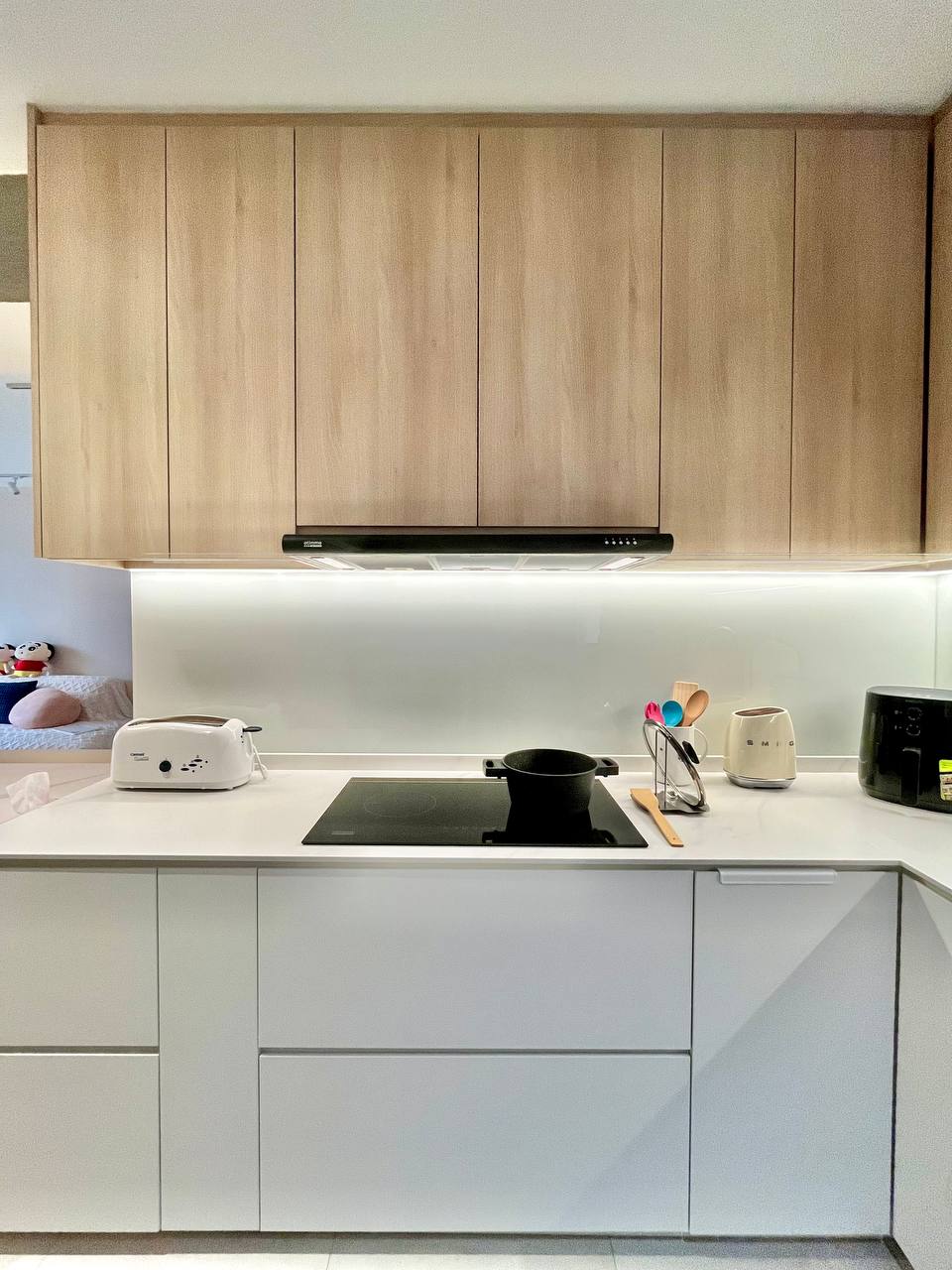 Turning a Small L-Shaped Kitchen Look and Feel Bigger  - Wooden cabinets, modern kitchen, sleek design, minimalist decor