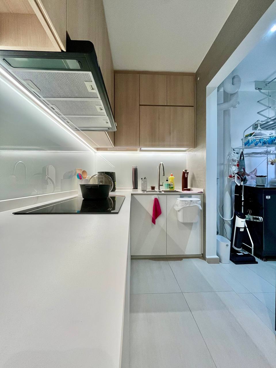 Turning a Small L-Shaped Kitchen Look and Feel Bigger  - Modern kitchen with sleek design, white countertops, built-in