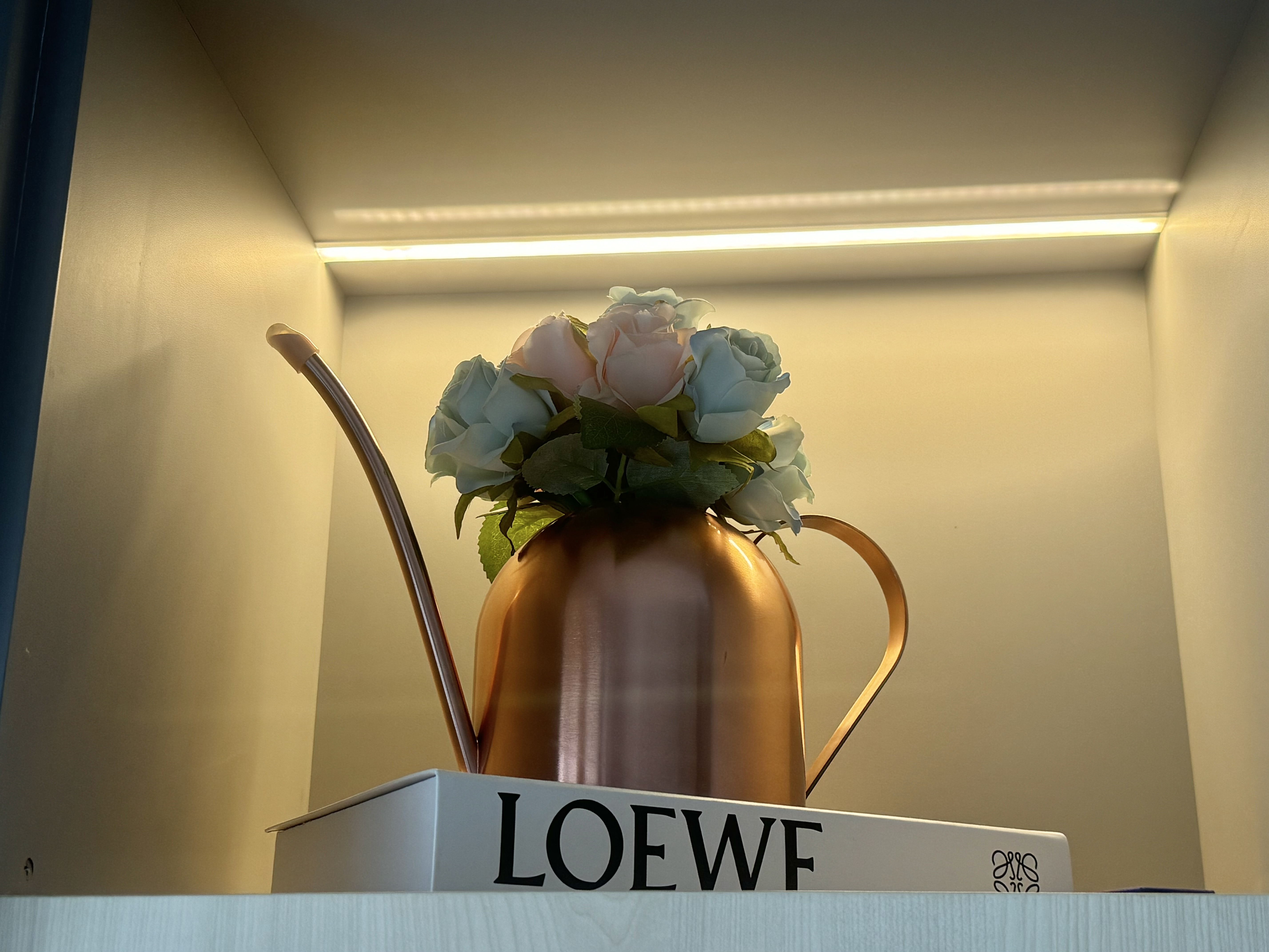 Home Decor: Repurpose & Display of Household Items - vibrant copper pitcher, delicate flowers, pastel roses, soft lighting