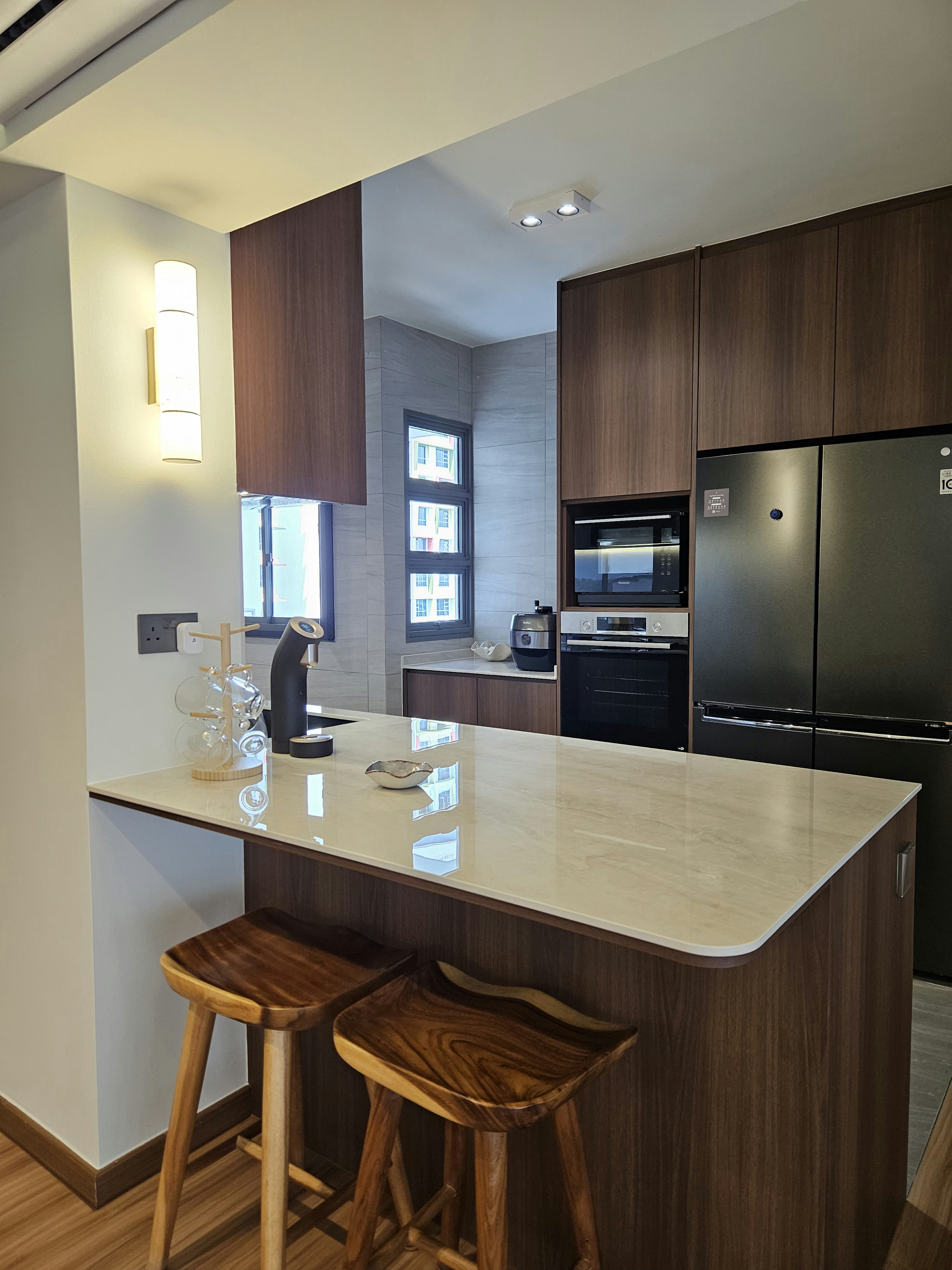 Our Pride and Joy: A Fully-Equipped Kitchen Within 10.5sqm - Modern kitchen with sleek design, wooden cabinets, black