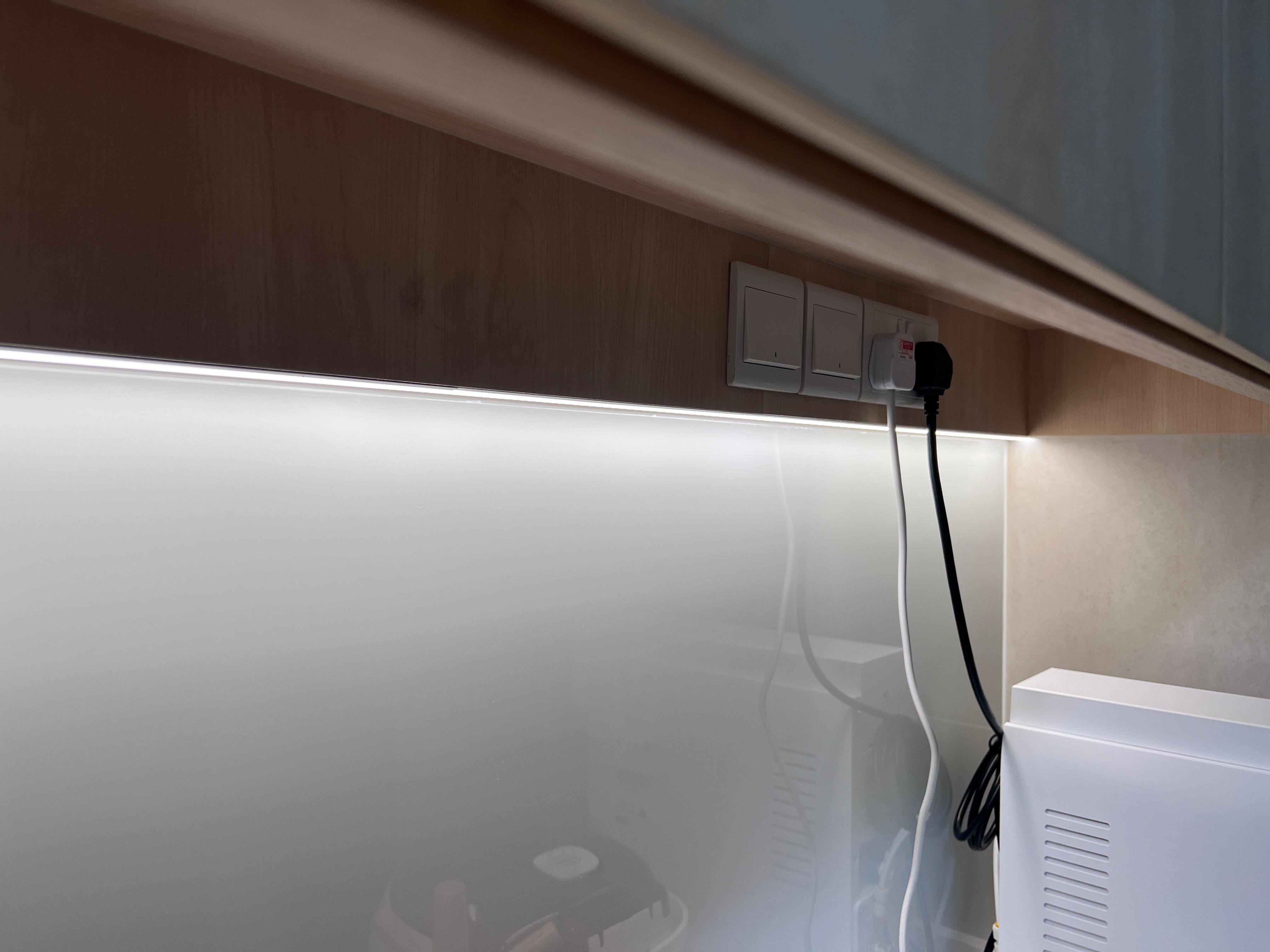 Into our minimalist kitchen - Wooden wall, modern kitchen, under-counter space, illuminated area, white appliance, power