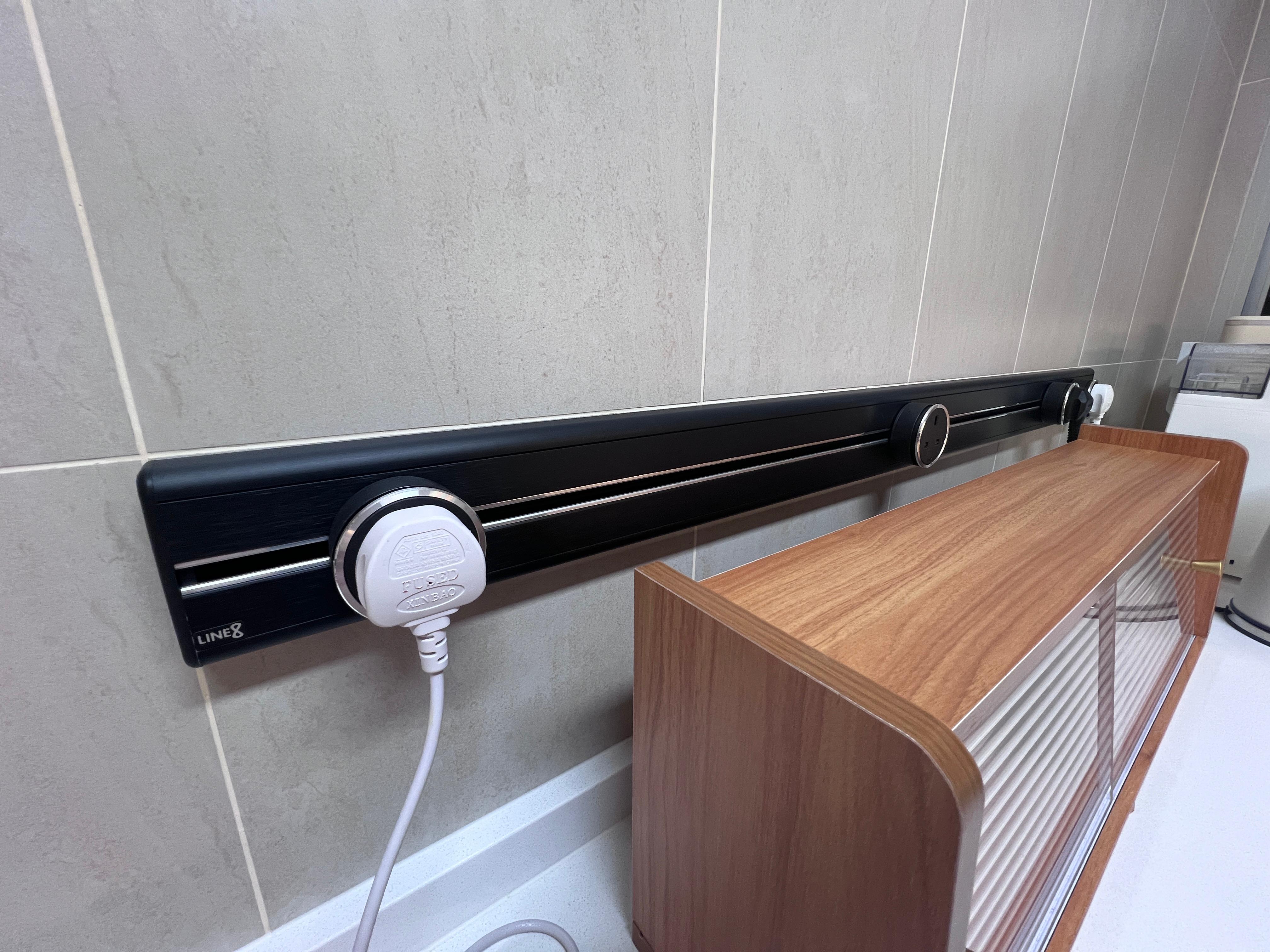 Into our minimalist kitchen - Wall-mounted charging station, wireless charging pad, black charging rail, wooden cabinet
