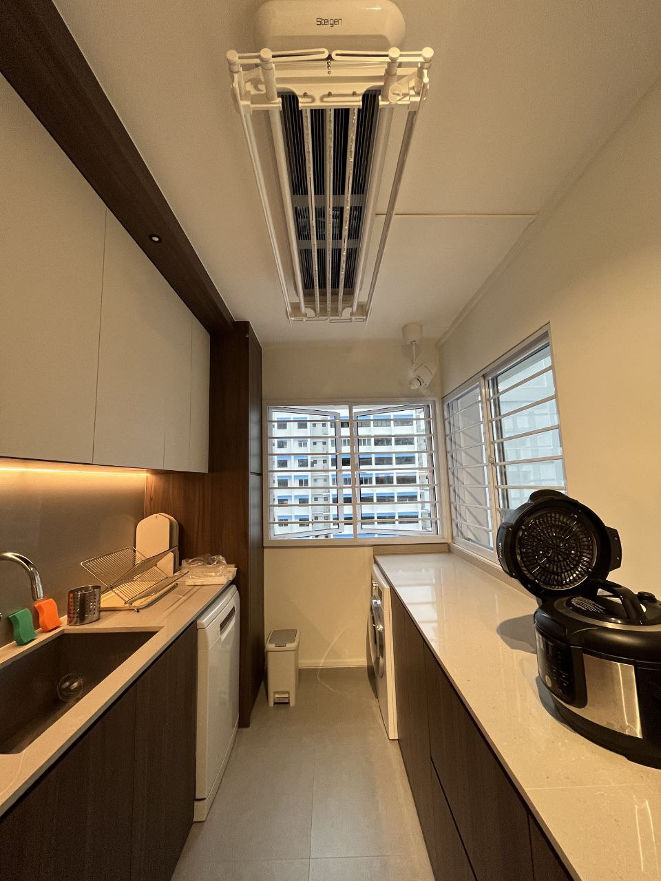 Our Kitchen: endless countertop space - Modern kitchen with built-in appliances, white and brown cabinetry, stainless steel
