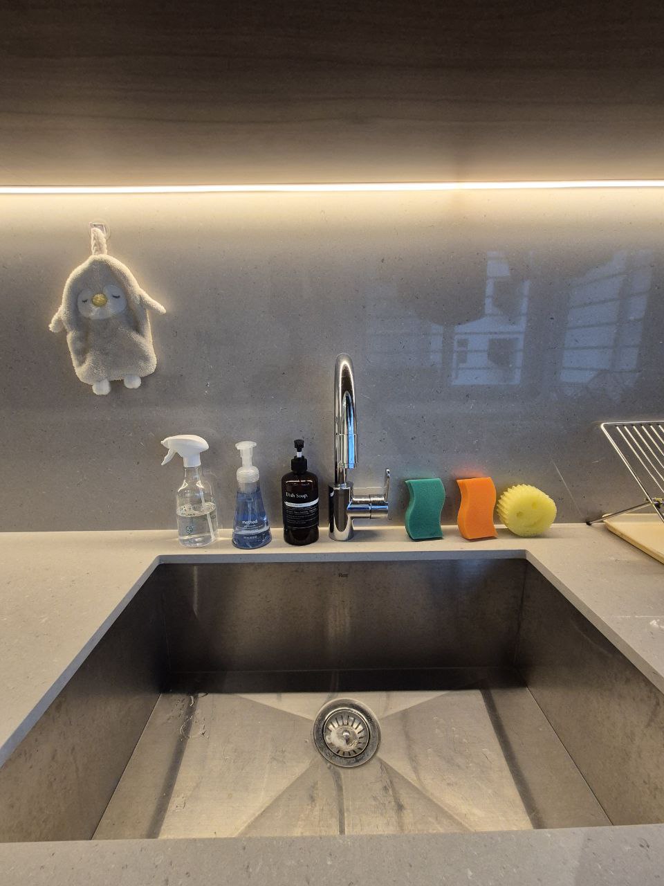 Our Kitchen: endless countertop space - cleaning supplies, bathroom countertop, modern sink, stainless steel sink, green