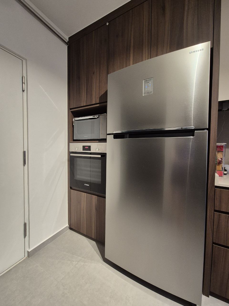 Our Kitchen: endless countertop space - Modern kitchen with sleek stainless steel refrigerator, built-in oven, microwave, and