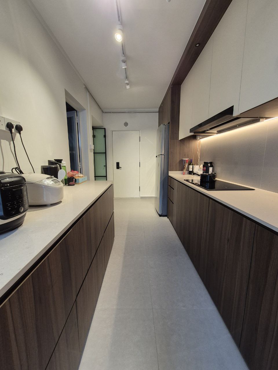 Our Kitchen: endless countertop space - Modern kitchen with sleek design, white countertops, dark wood cabinets, built-in