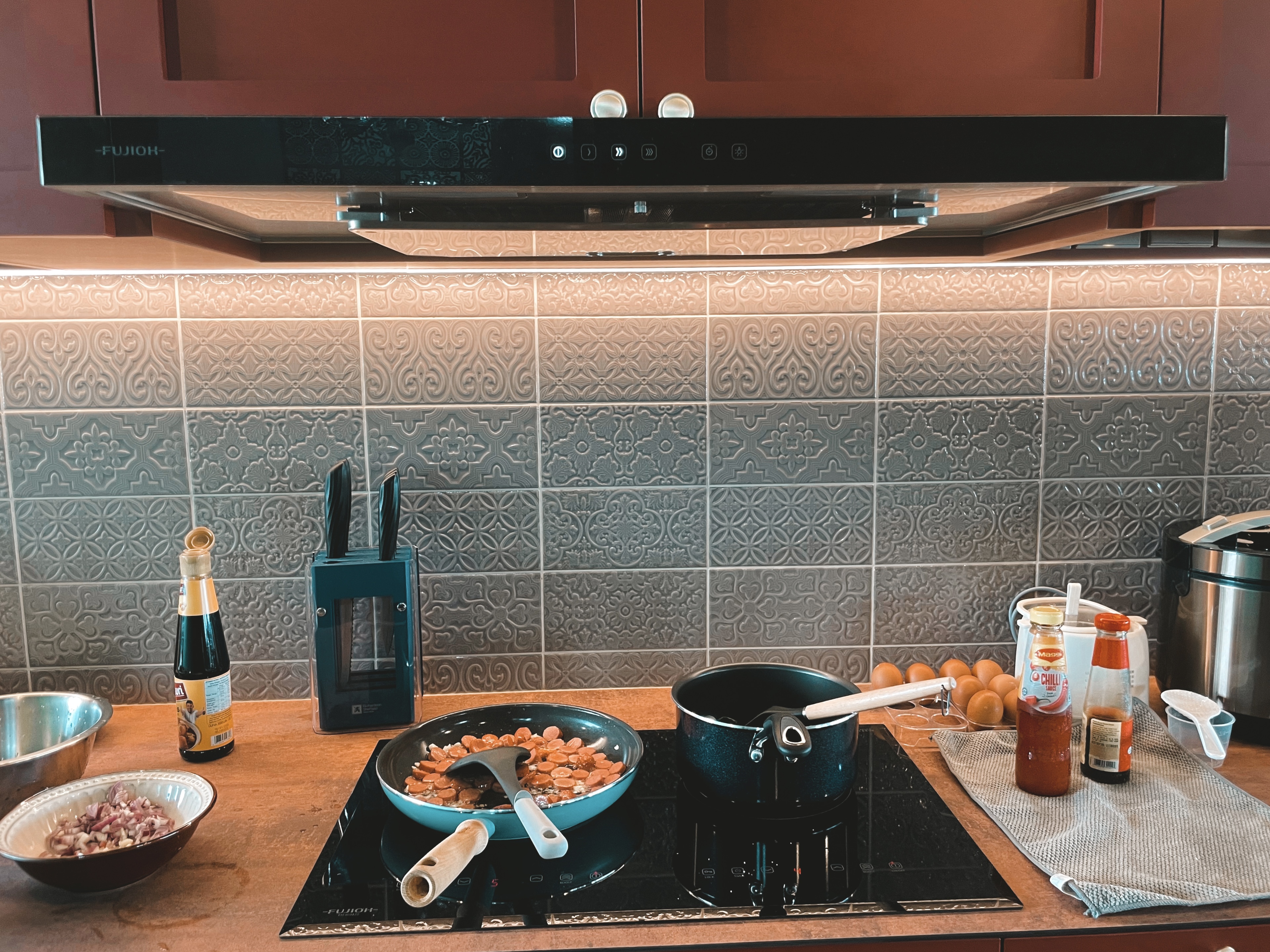 Bold and Unique: Our Open Kitchen with an Unconventional Color Palette - Futon, kitchen, stove, cooking, frying, sausages