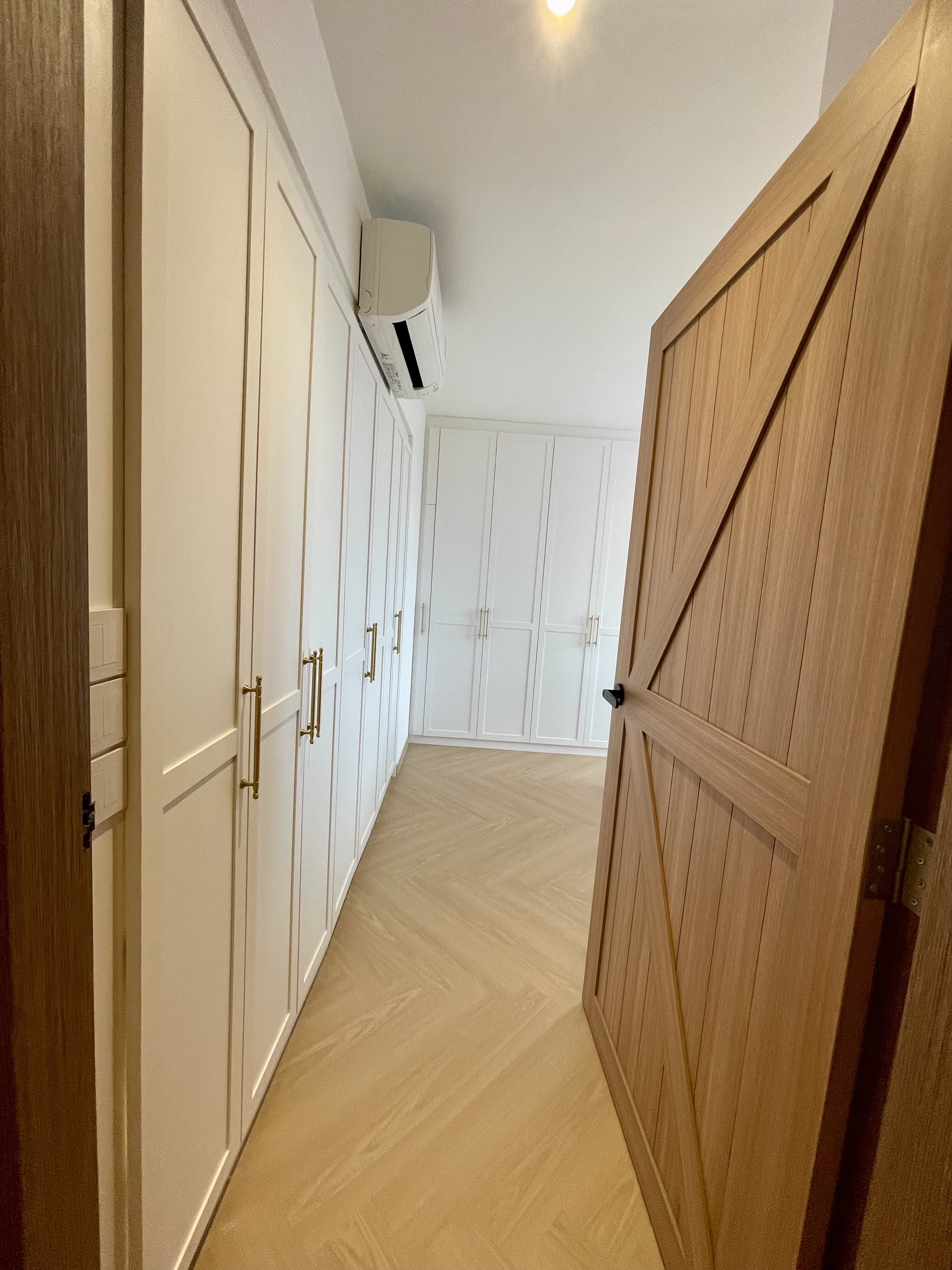Our Bathroom Sanctuaries: A Concealed Luxe Master Ensuite VS Resort - White cabinetry, wooden doors, herringbone-patterned