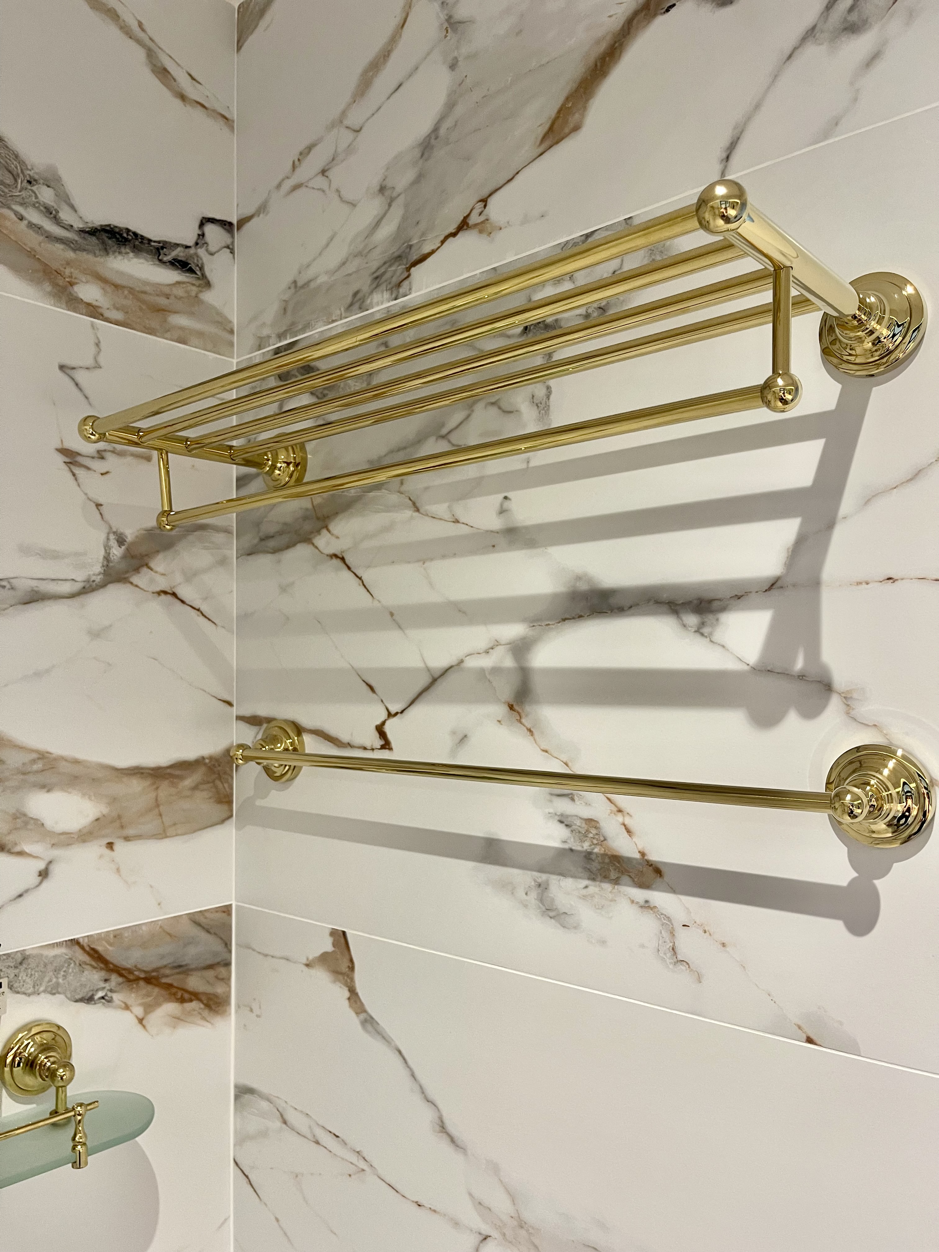 Our Bathroom Sanctuaries: A Concealed Luxe Master Ensuite VS Resort - gold towel rack, marble wall, luxurious bathroom