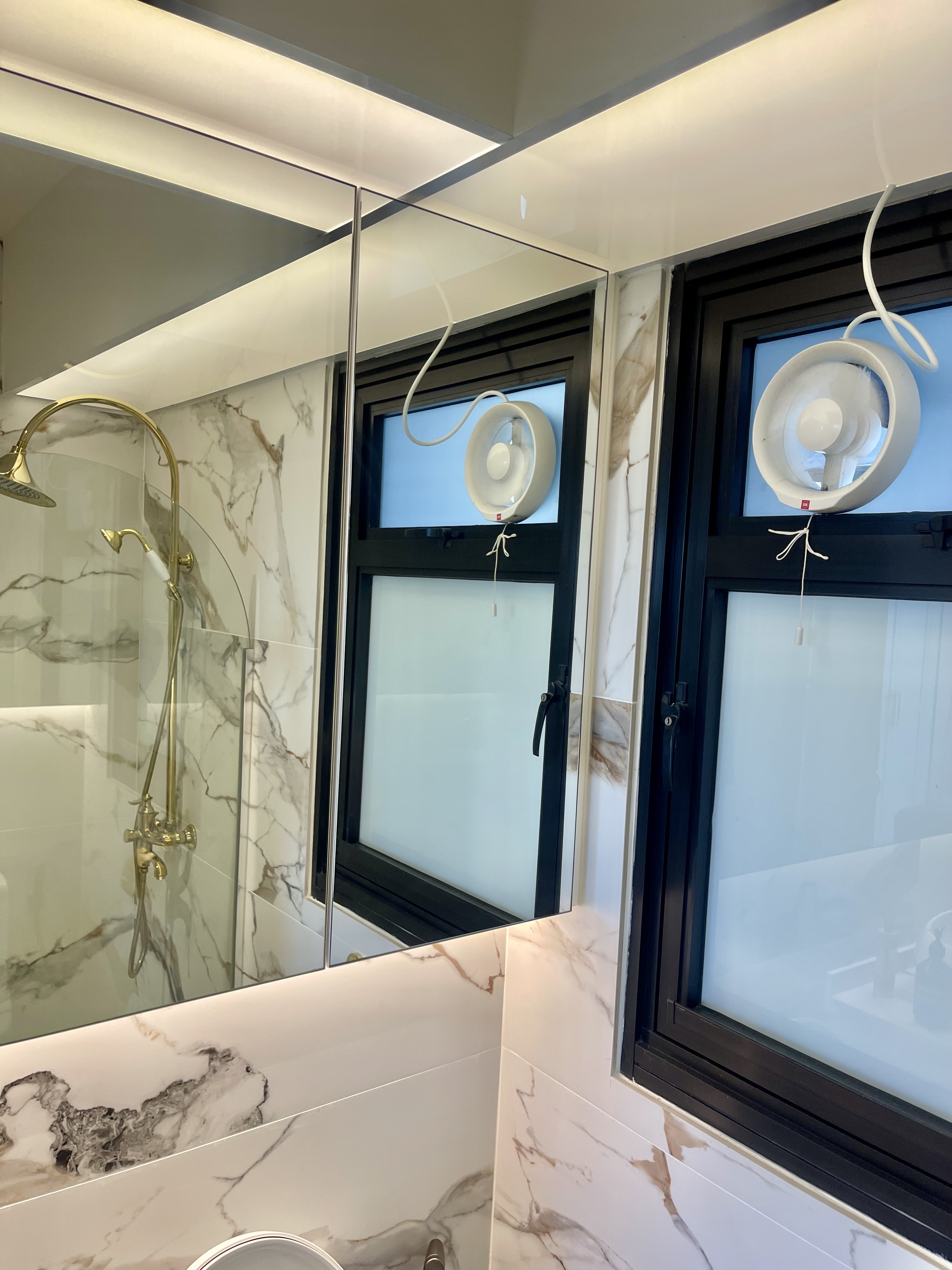 Our Bathroom Sanctuaries: A Concealed Luxe Master Ensuite VS Resort - Marble-patterned bathroom vanity, modern shower