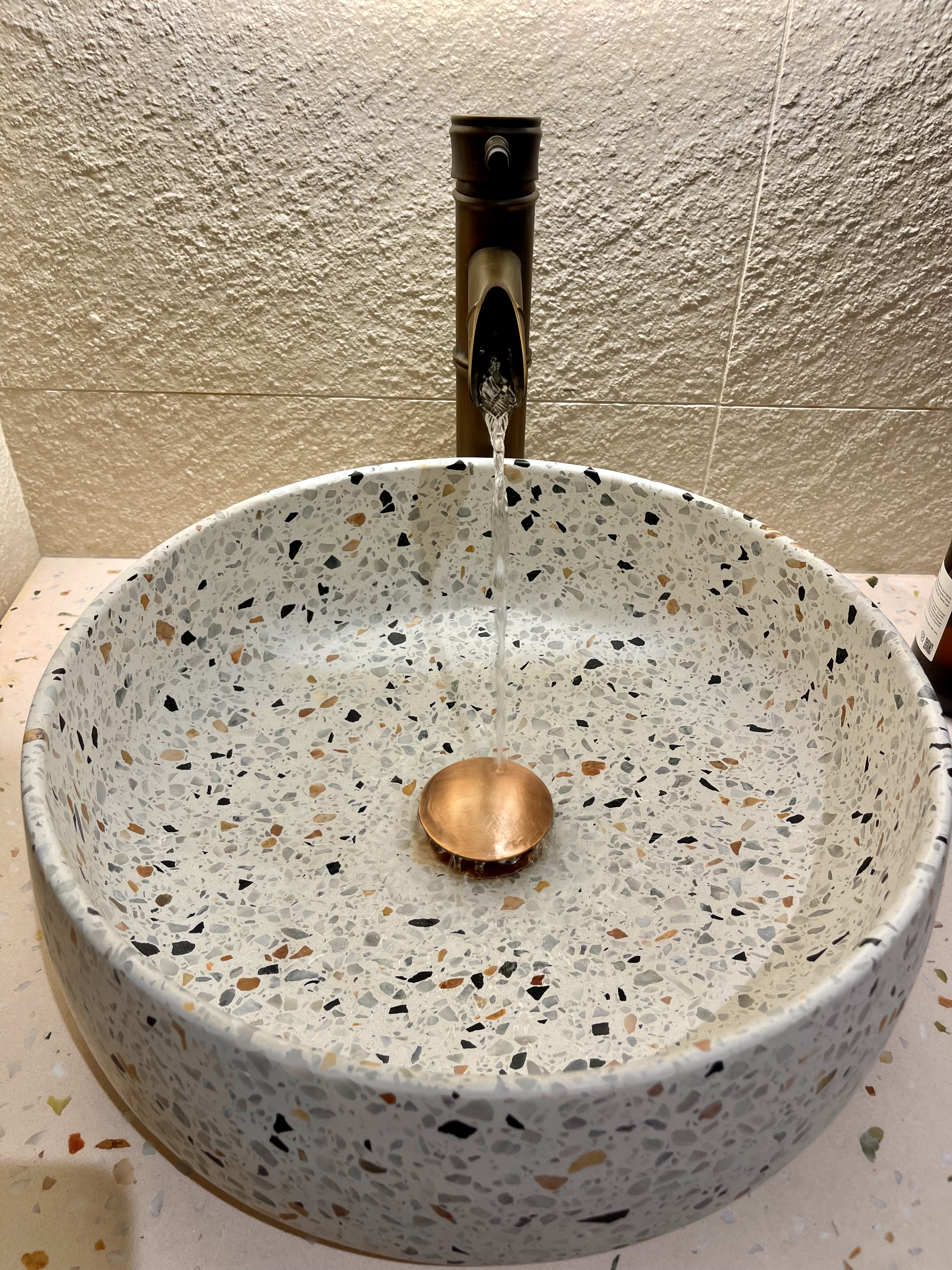 Our Bathroom Sanctuaries: A Concealed Luxe Master Ensuite VS Resort - mosaic sink, water flowing, decorative basin, copper