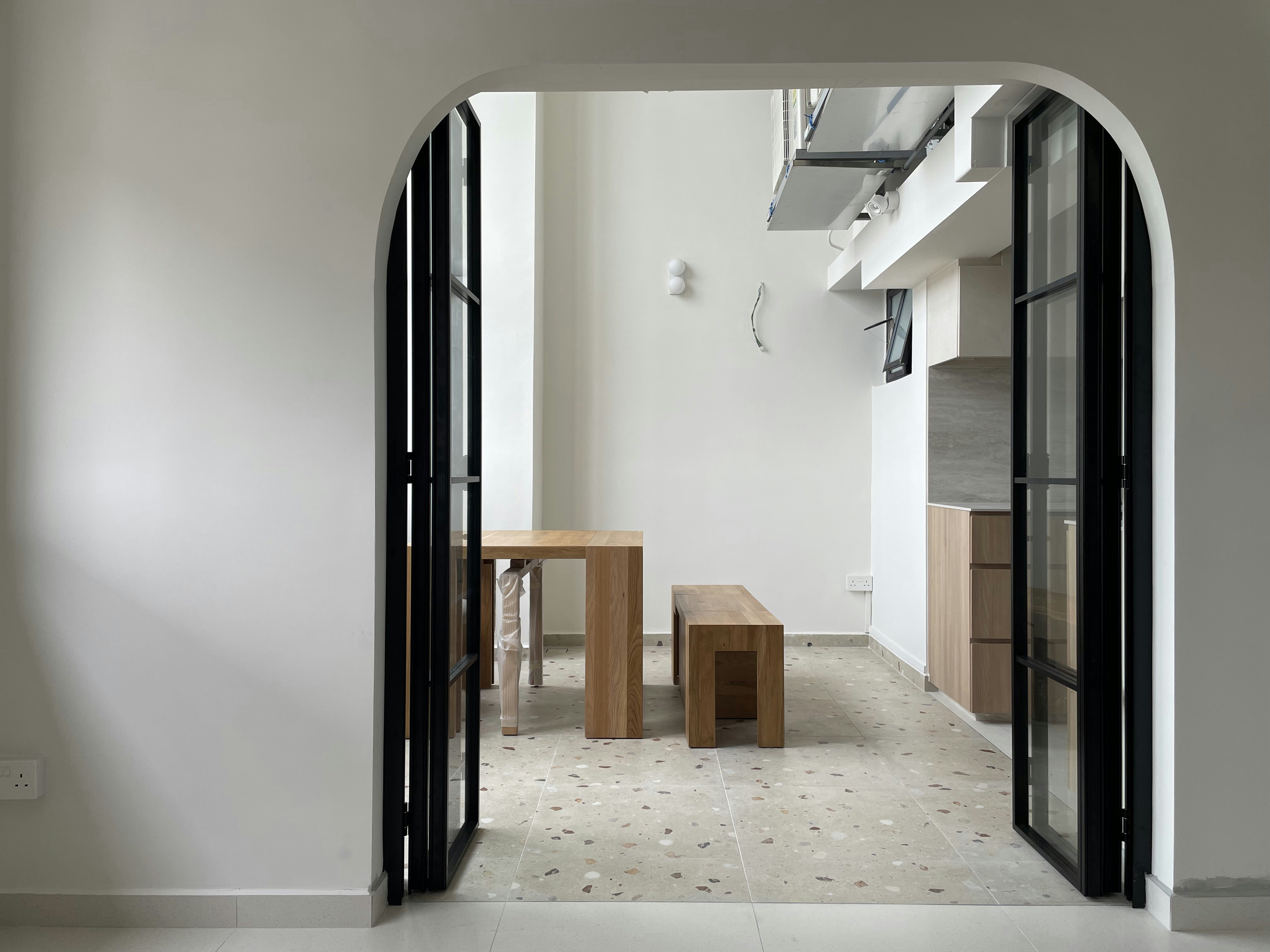 Living Simply: Our Minimalist, no-TV Living Room Reveal - Modern minimalist interior, sleek black doors, wooden table and