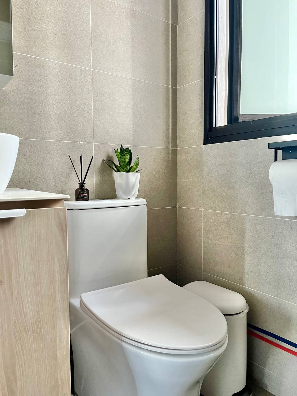 Toilet / Bathroom: Practicality Over Style on a Budget - White toilet, beige tiled walls, modern bathroom, minimalist design