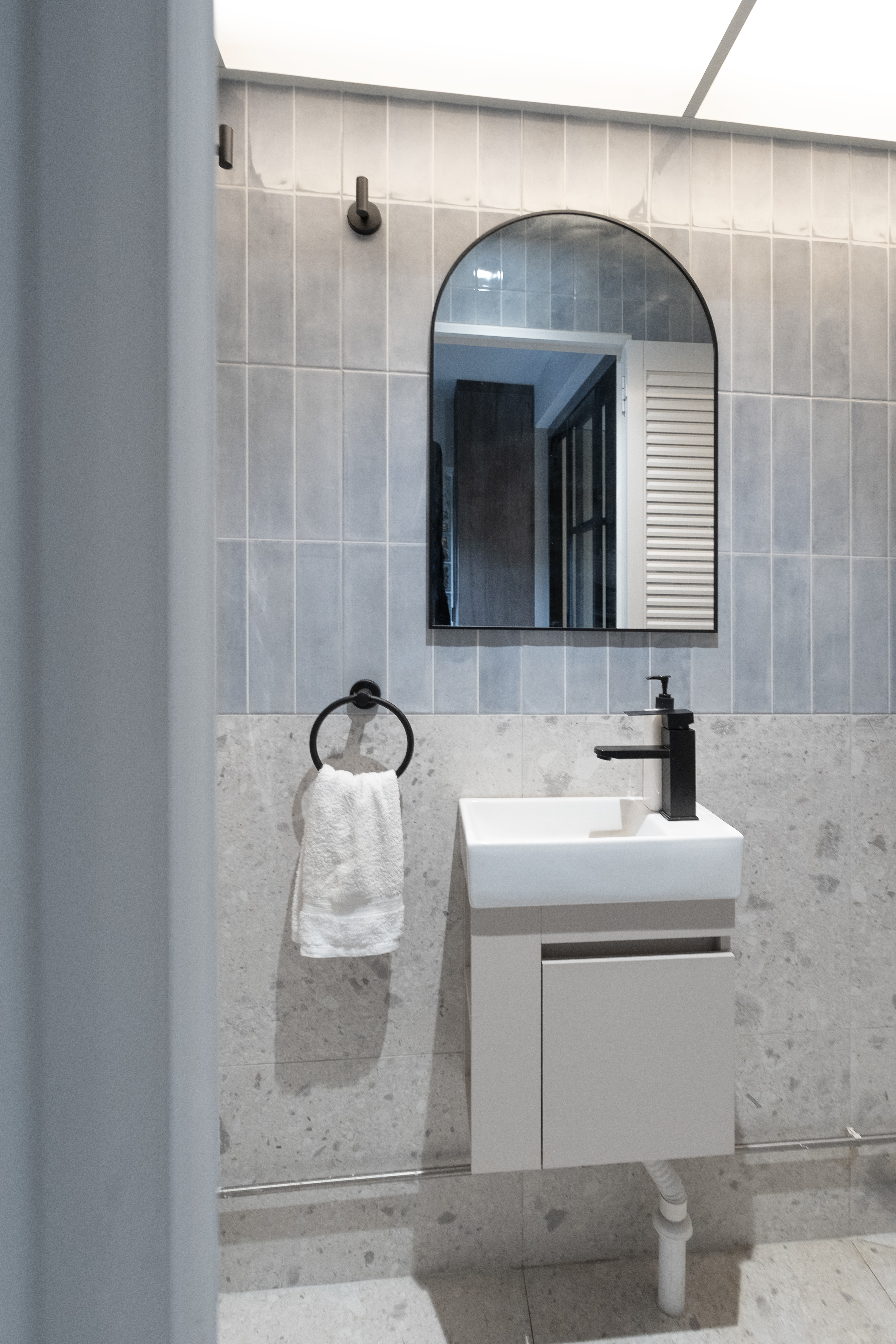 Tiny-Guest-Bathroom-Redesign-with-Watercolor-Blue-and-Grey-Accents