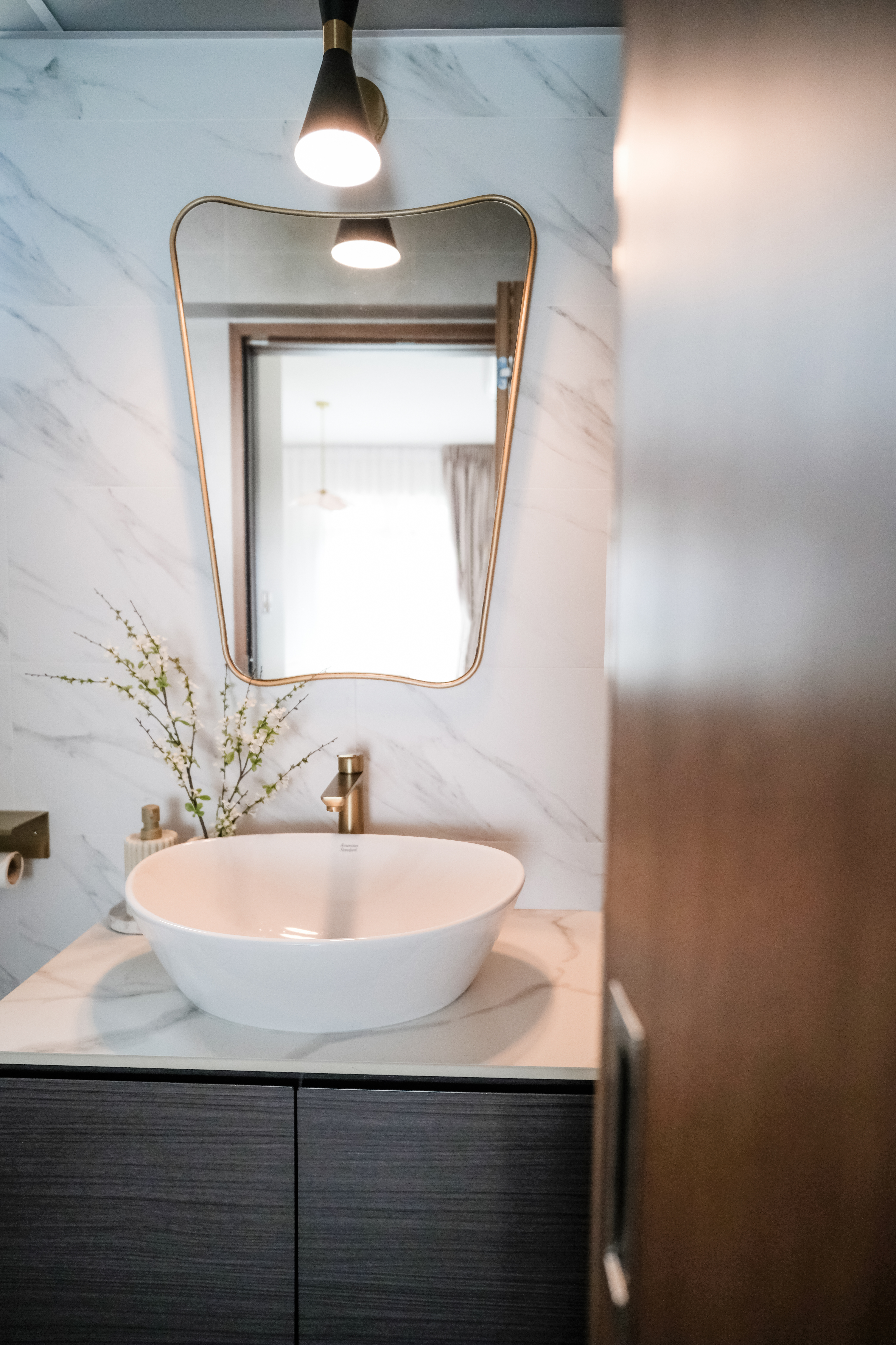 Sunlit Elegance: A Modern Bathroom Designed for Timeless Durability - modern bathroom vanity, sleek sink, white marble