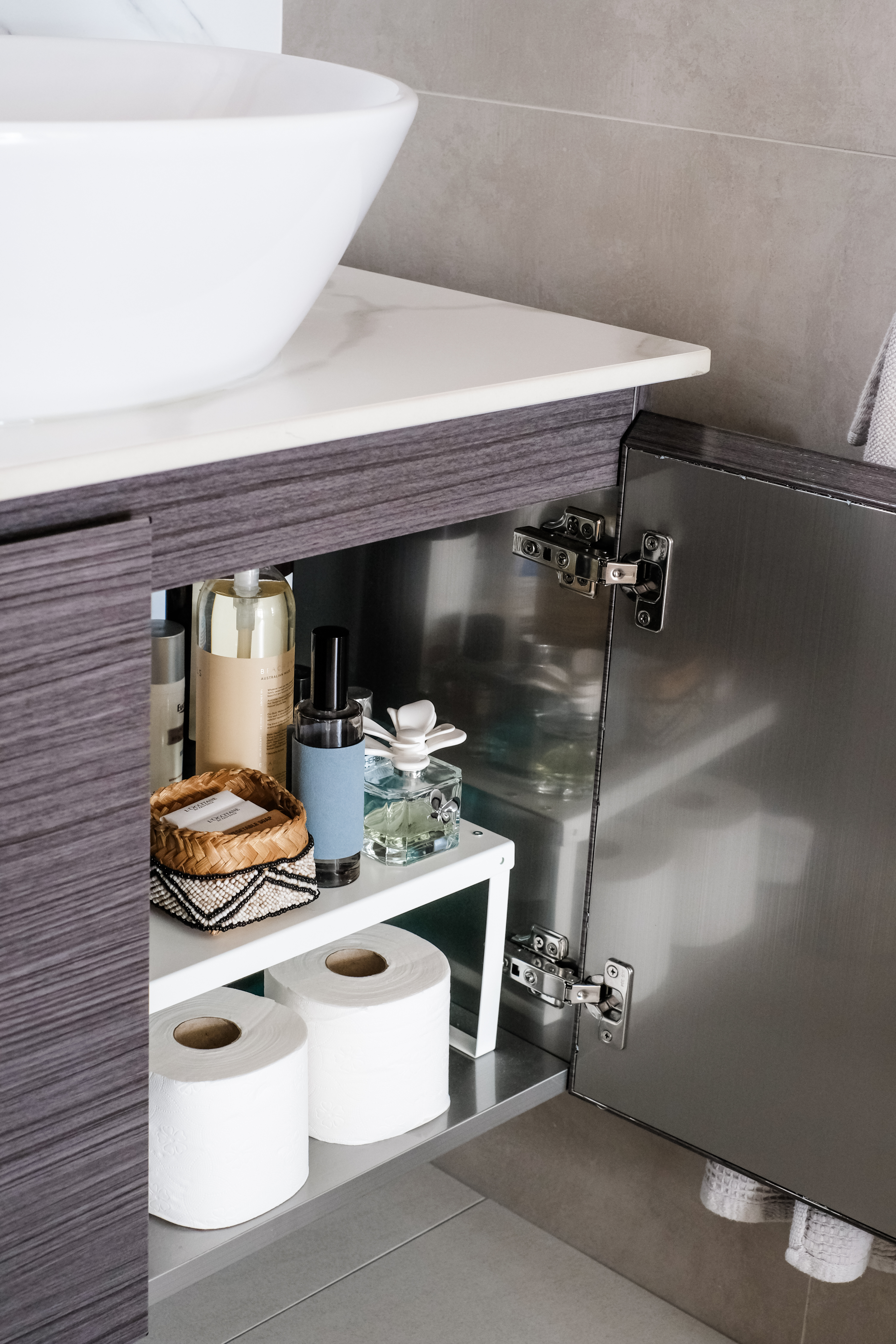 Sunlit Elegance: A Modern Bathroom Designed for Timeless Durability - modern bathroom vanity, white ceramic sink, gray marble