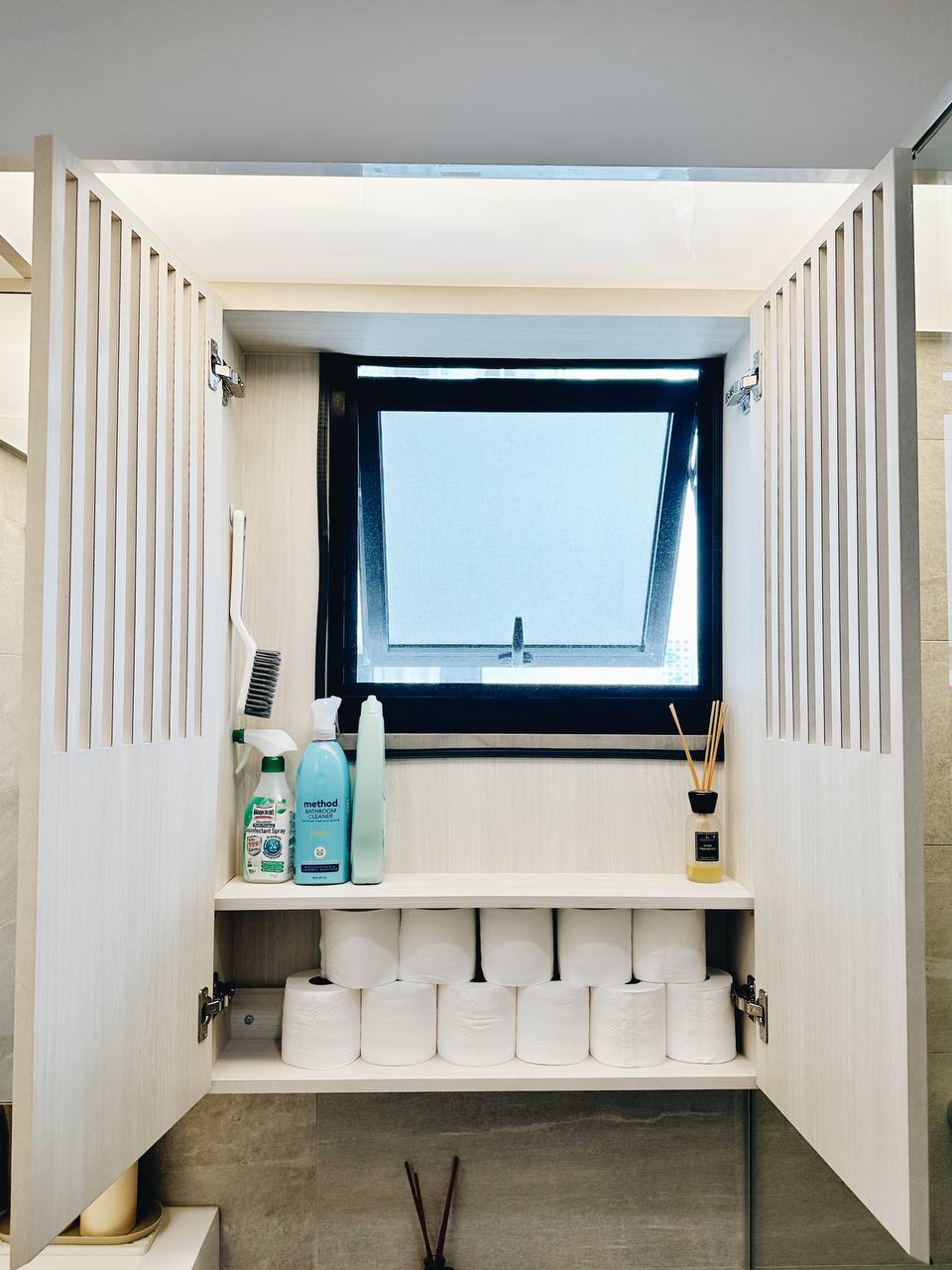 Our Master Bathroom: Fluted mirror storage cabinet!  - Bathroom vanity, white cabinets, neatly organized, toilet paper