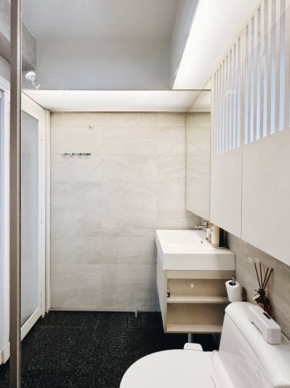 Our Master Bathroom: Fluted mirror storage cabinet!  - Modern minimalist bathroom, sleek design, white fixtures, tiled walls