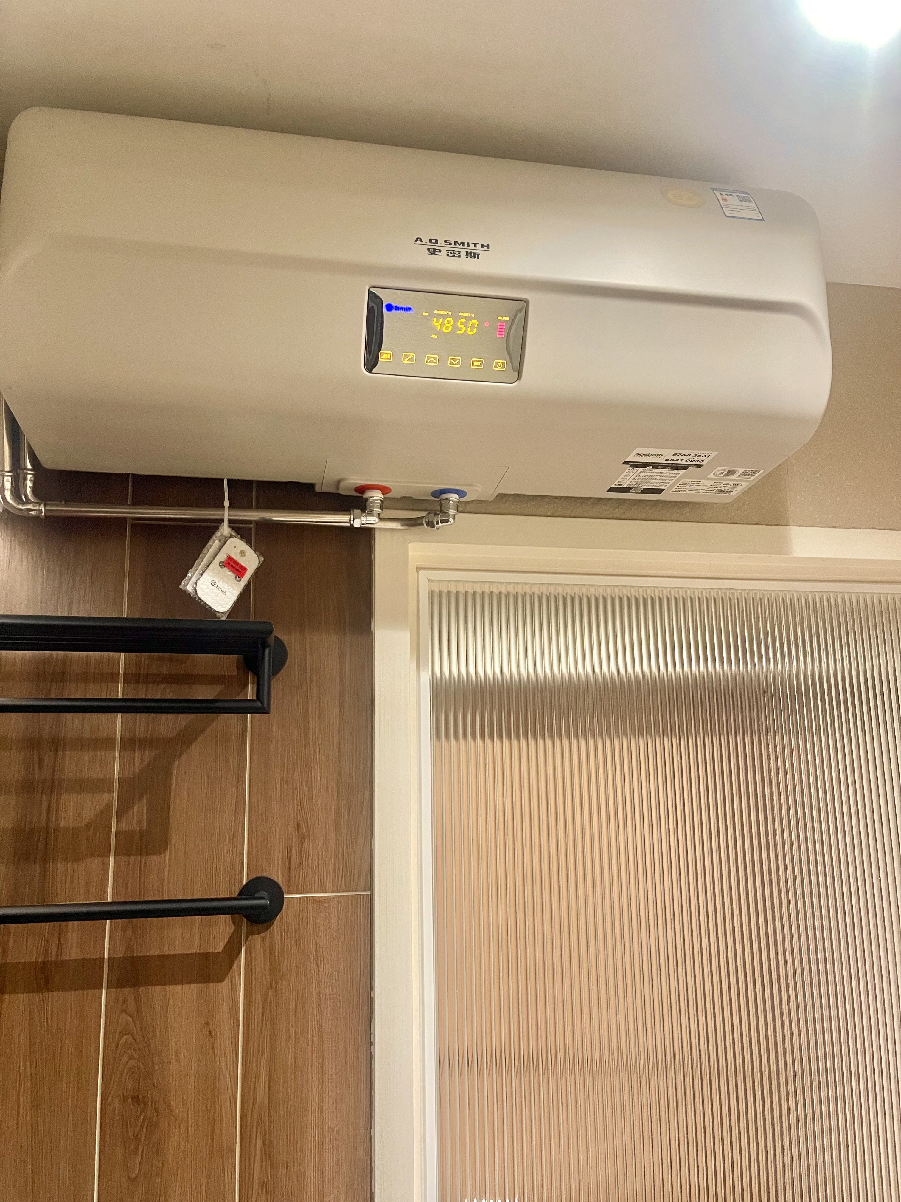 Our Bathroom Sanctuaries: A Concealed Luxe Master Ensuite VS Resort - A.O. Smith air conditioner unit, digital display