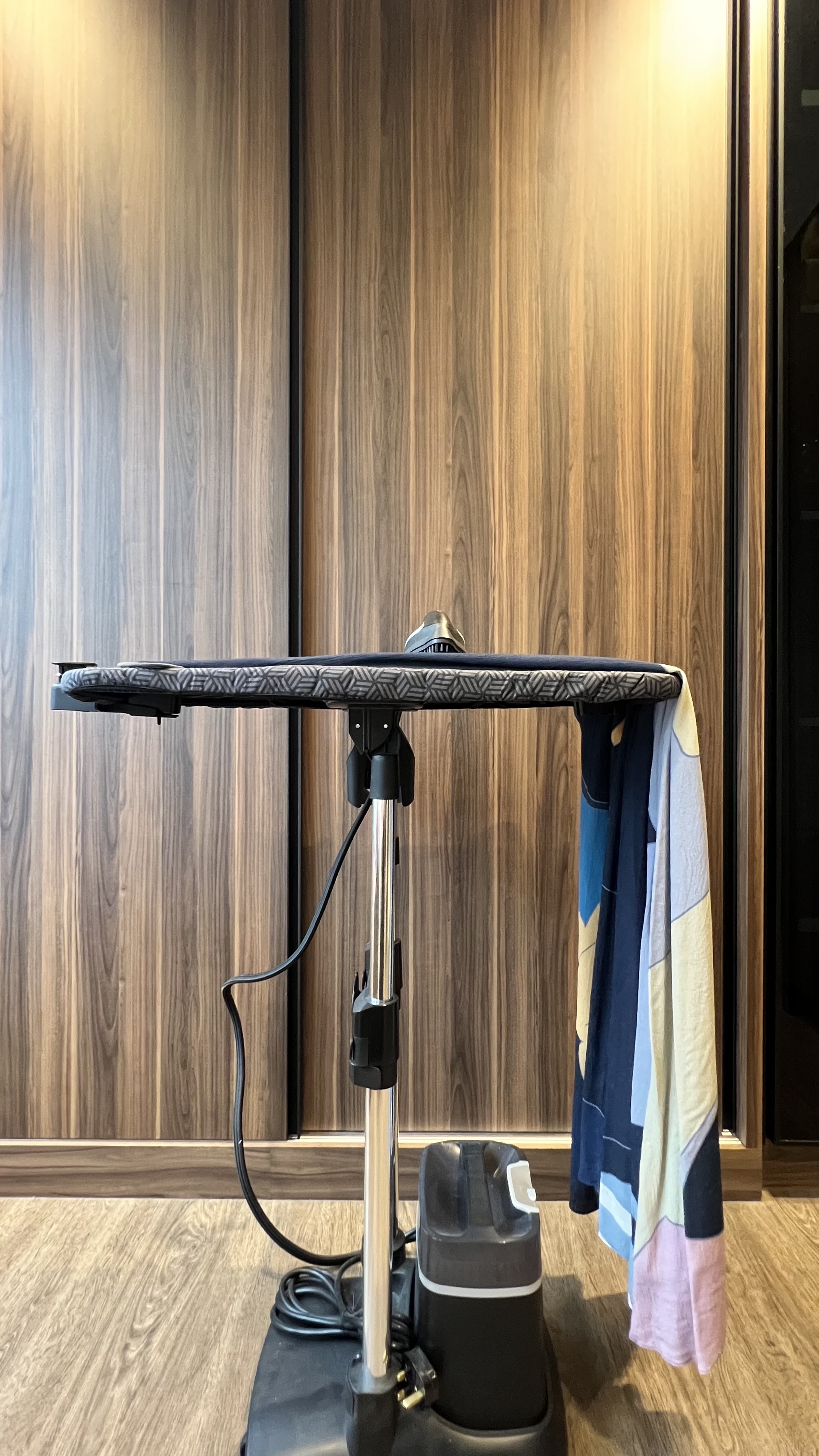 Transforming Spaces: From Wardrobe Sanctuary to Workout Haven - Wooden wall, modern furniture, floor-standing ironing board